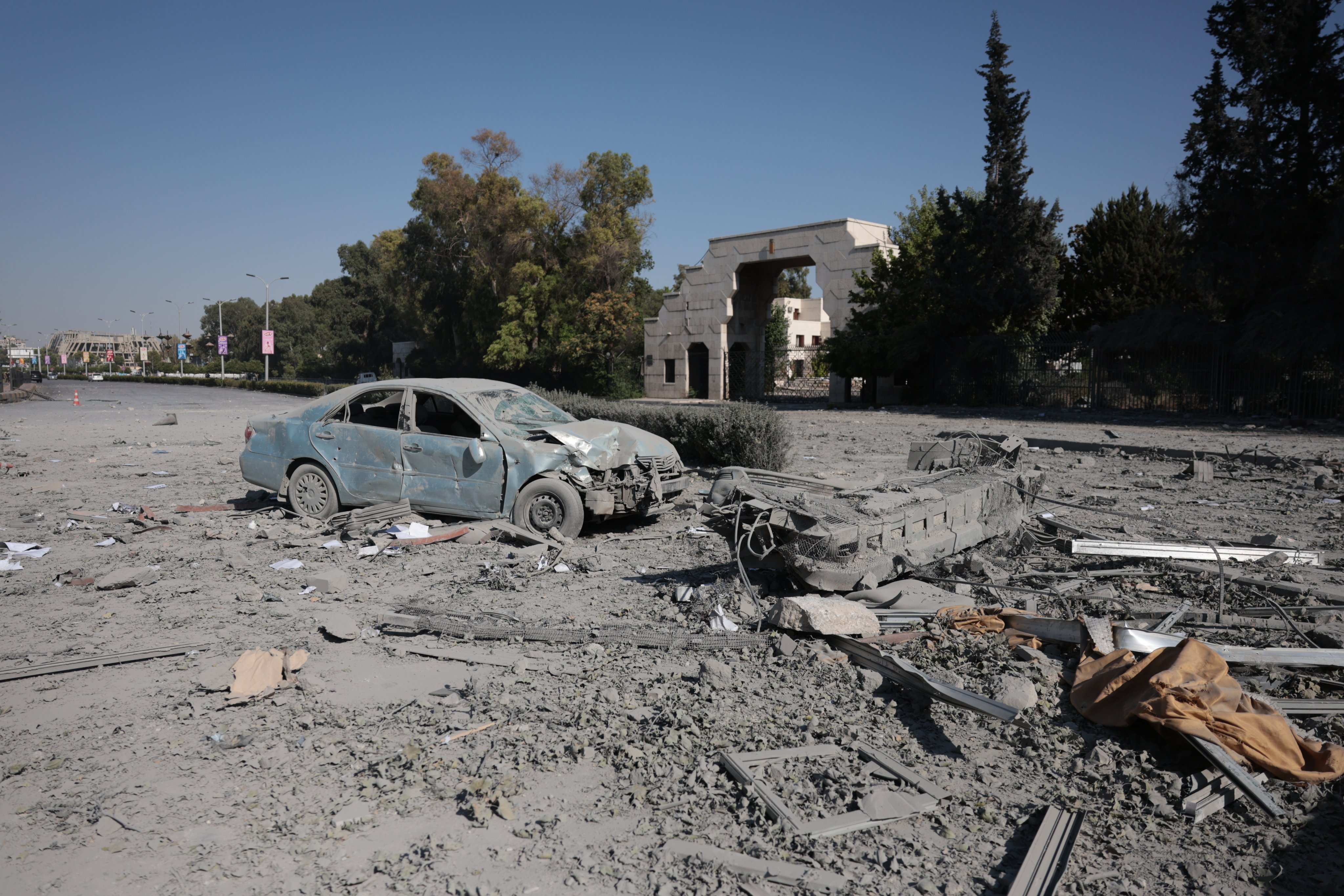 A damaged vehicle outside the Syrian Ministry of Defence building, which houses the military’s General Staff Headquarters, following an Israeli airstrike in Damascus, Syria, on Wednesday. Photo: EPA
