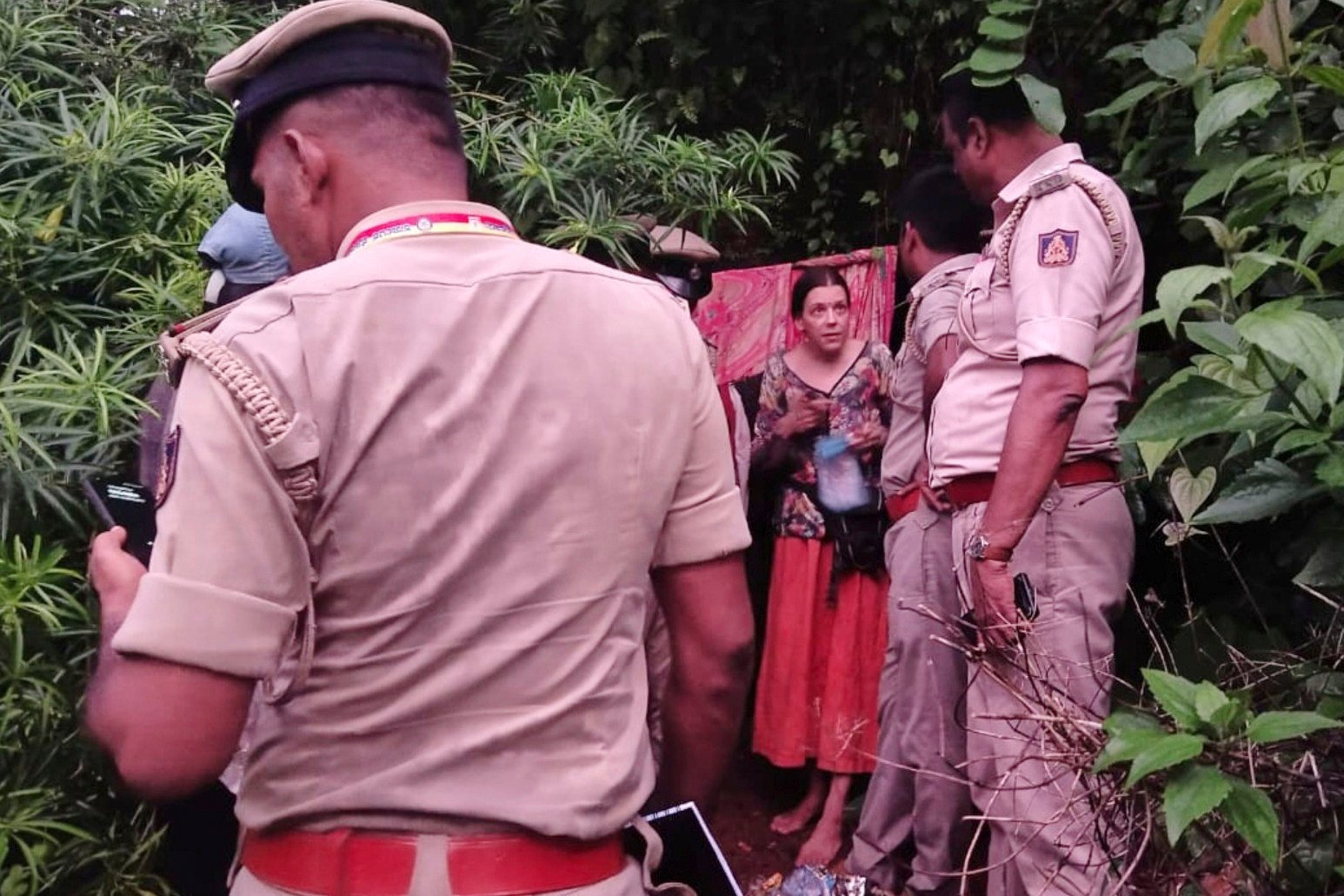 Indian policemen rescue Nina Kutina, , a Russian woman, from a cave in a forest area in the southern Indian state of Karnataka. Photo: AP