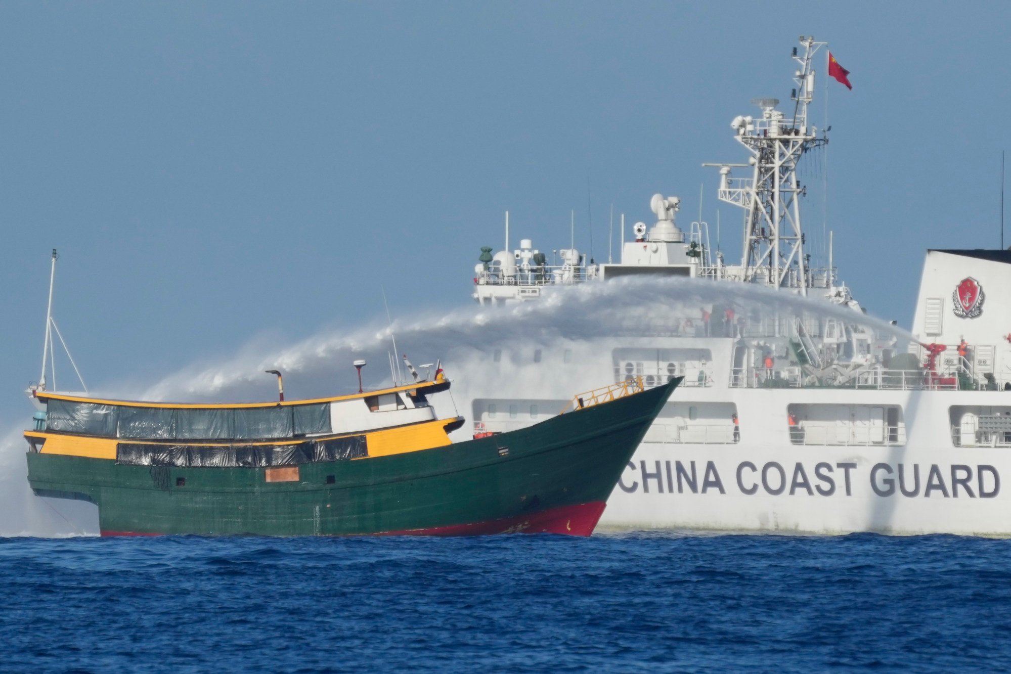 A Philippine resupply vessel is hit by a Chinese coastguard water cannon blast as it tries to enter the Second Thomas Shoal, locally known as Ayungin Shoal, in the disputed South China Sea in March 2024. Photo: AP