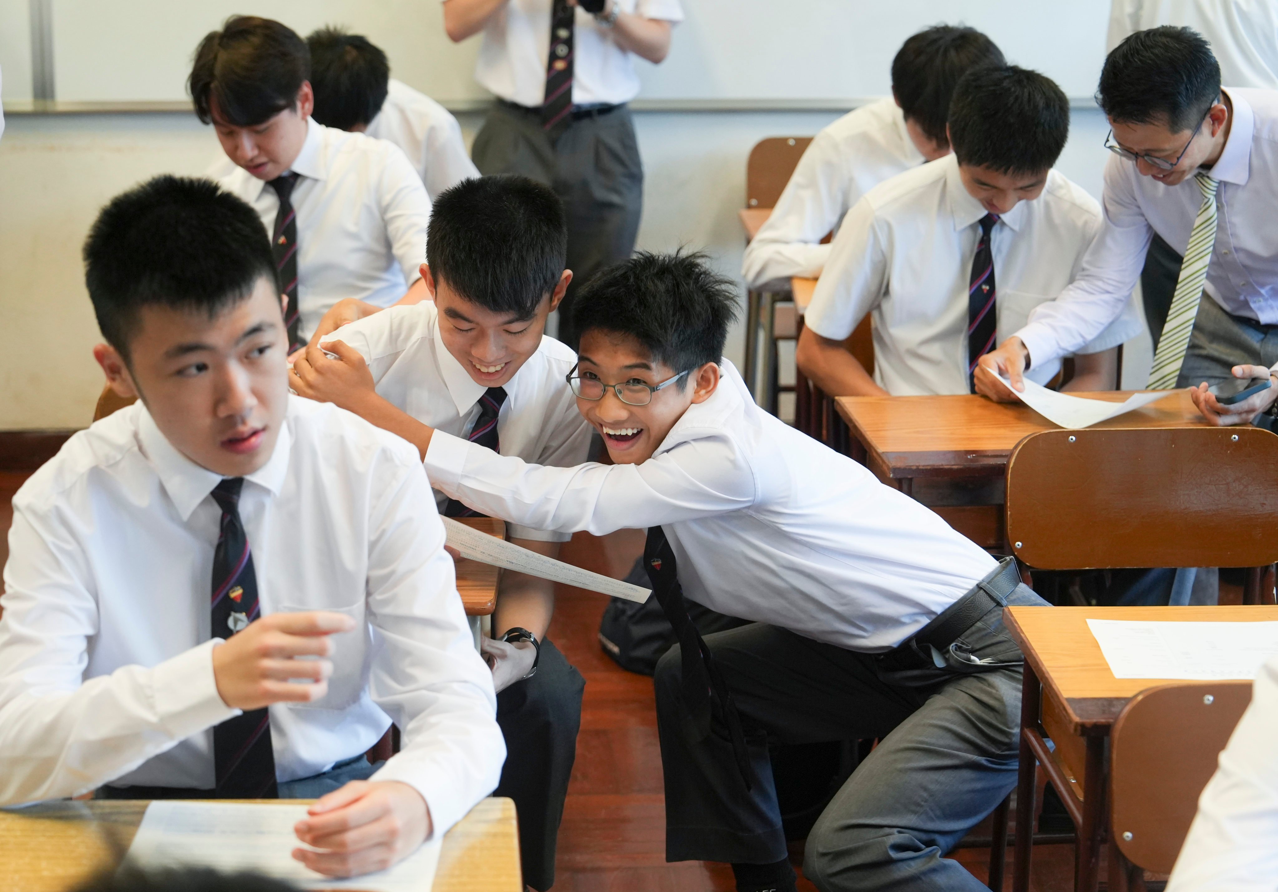 La Salle College students in Kowloon Tong react to their Diploma of Secondary Education Examination (DSE) results, on July 16. Photo: Sun Yeung