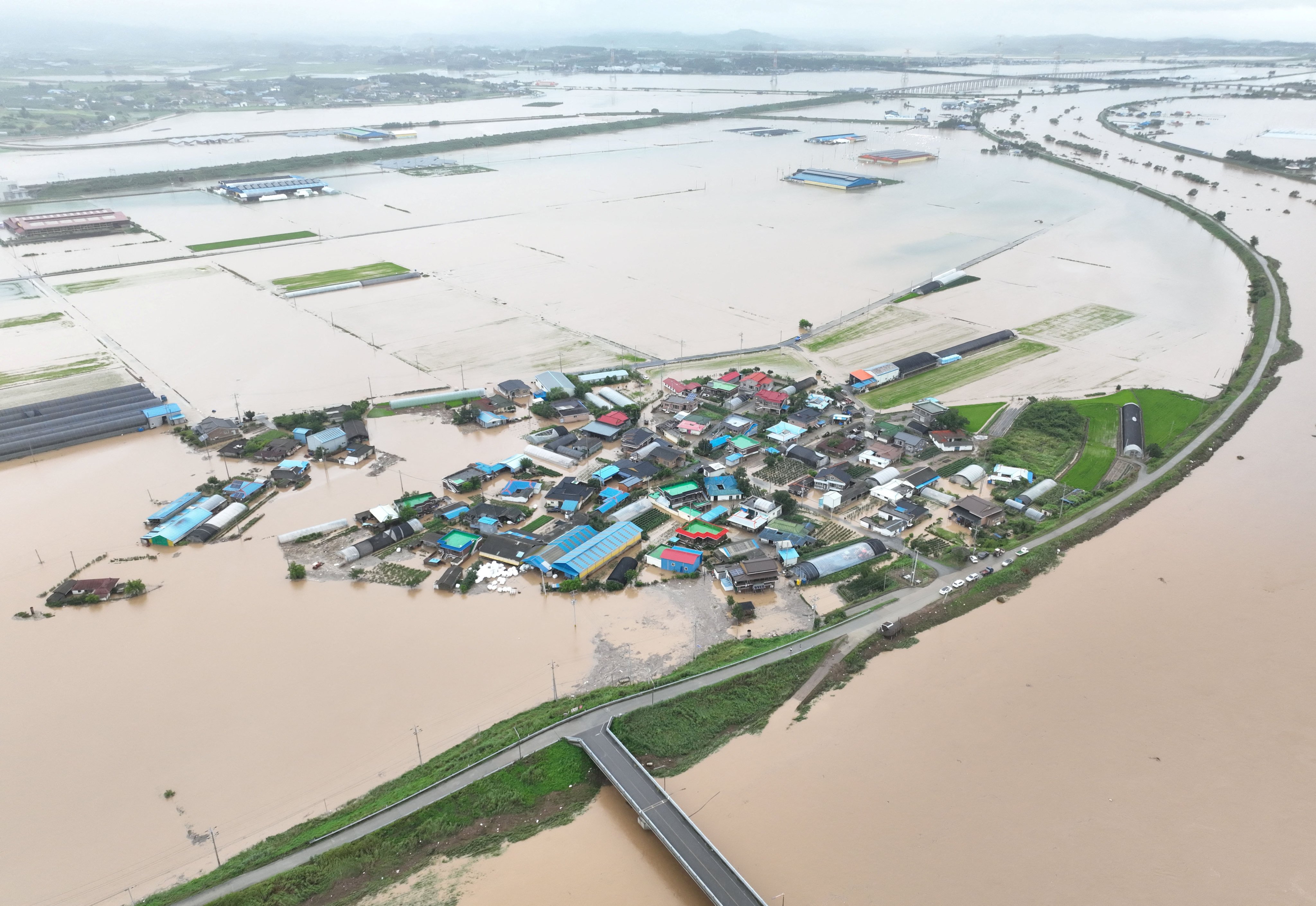 Flooding caused by torrential rain in Yesan, South Korea. Photo: Yonhap via Reuters