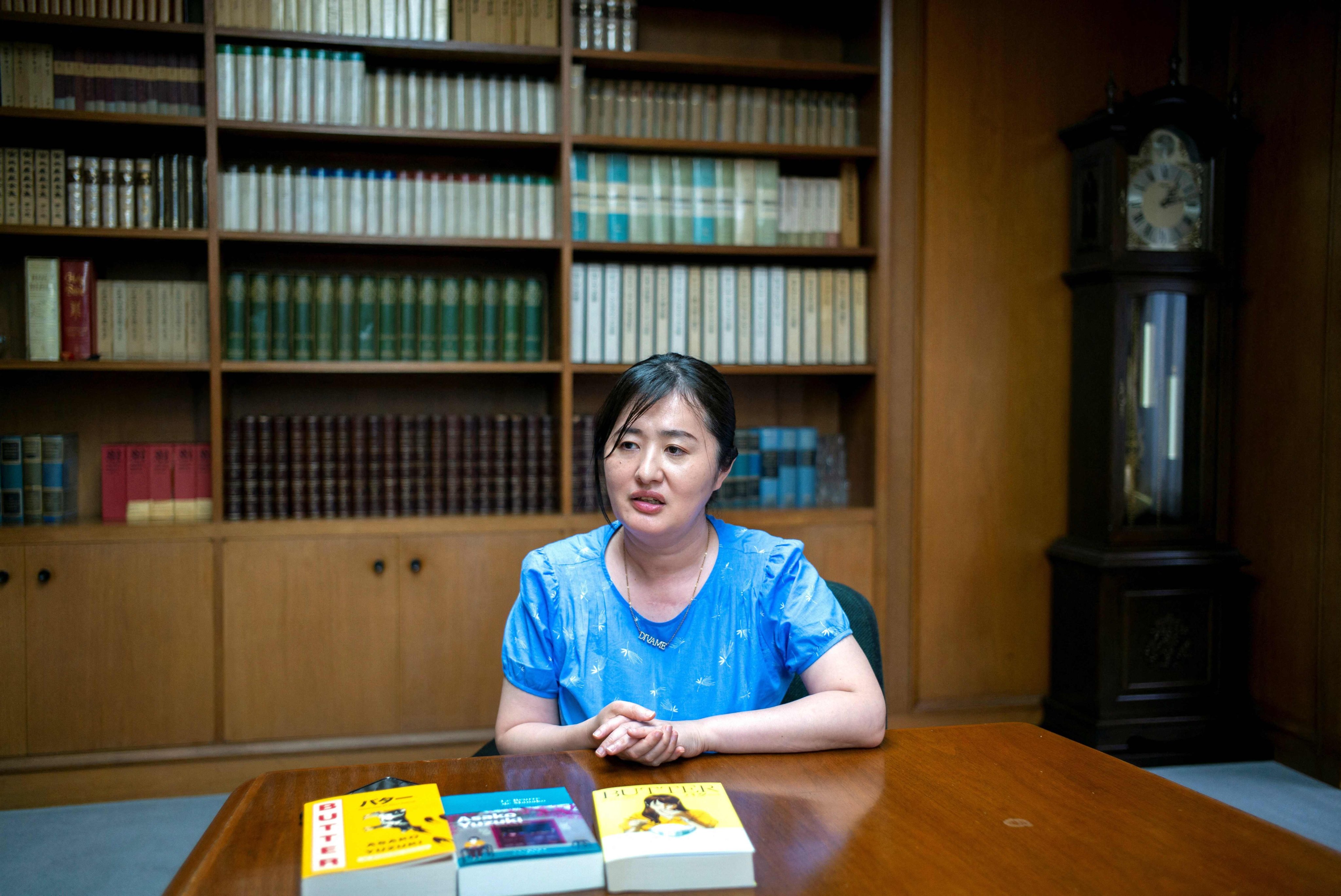 Japanese author Asako Yuzuki speaks during an interview in Tokyo on June 24, 2025. Her new novel Butter was inspired by the real-life story of “Black Widow” Kanae Kijima, a woman sentenced to death in 2012 for poisoning three men she met online. Photo: AFP