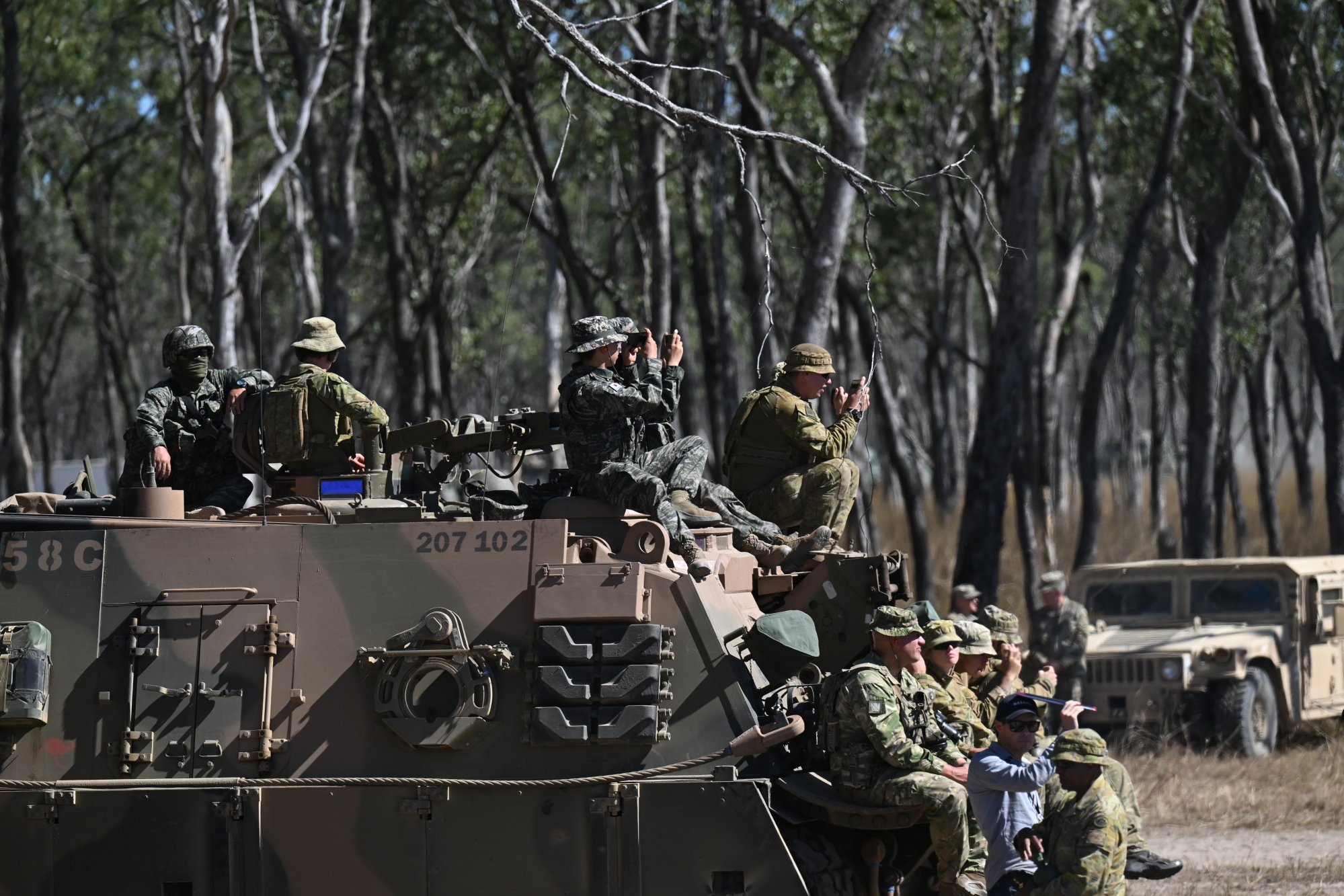 Military personnel watch the firepower demonstration as part of the Talisman Sabre 2025 joint military exercise in Australia on Monday. More than 35,000 troops from 18 nations are taking part in the drills. Photo: EPA Military personnel watch the firepower demonstration as part of the Talisman Sabre 2025 joint military exercise in Australia on Monday. More than 35,000 troops from 18 nations are taking part in the drills. Photo: EPA
