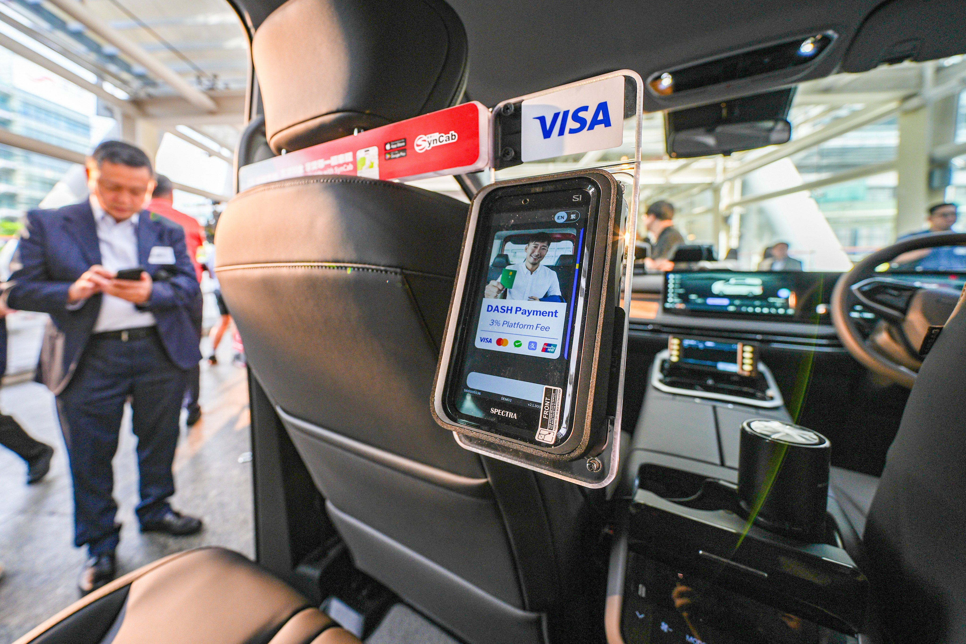 All Hong Kong taxi drivers will be required to provide at least two e-payment methods: one that uses QR codes and another that does not rely on them. Photo: Eugene Lee