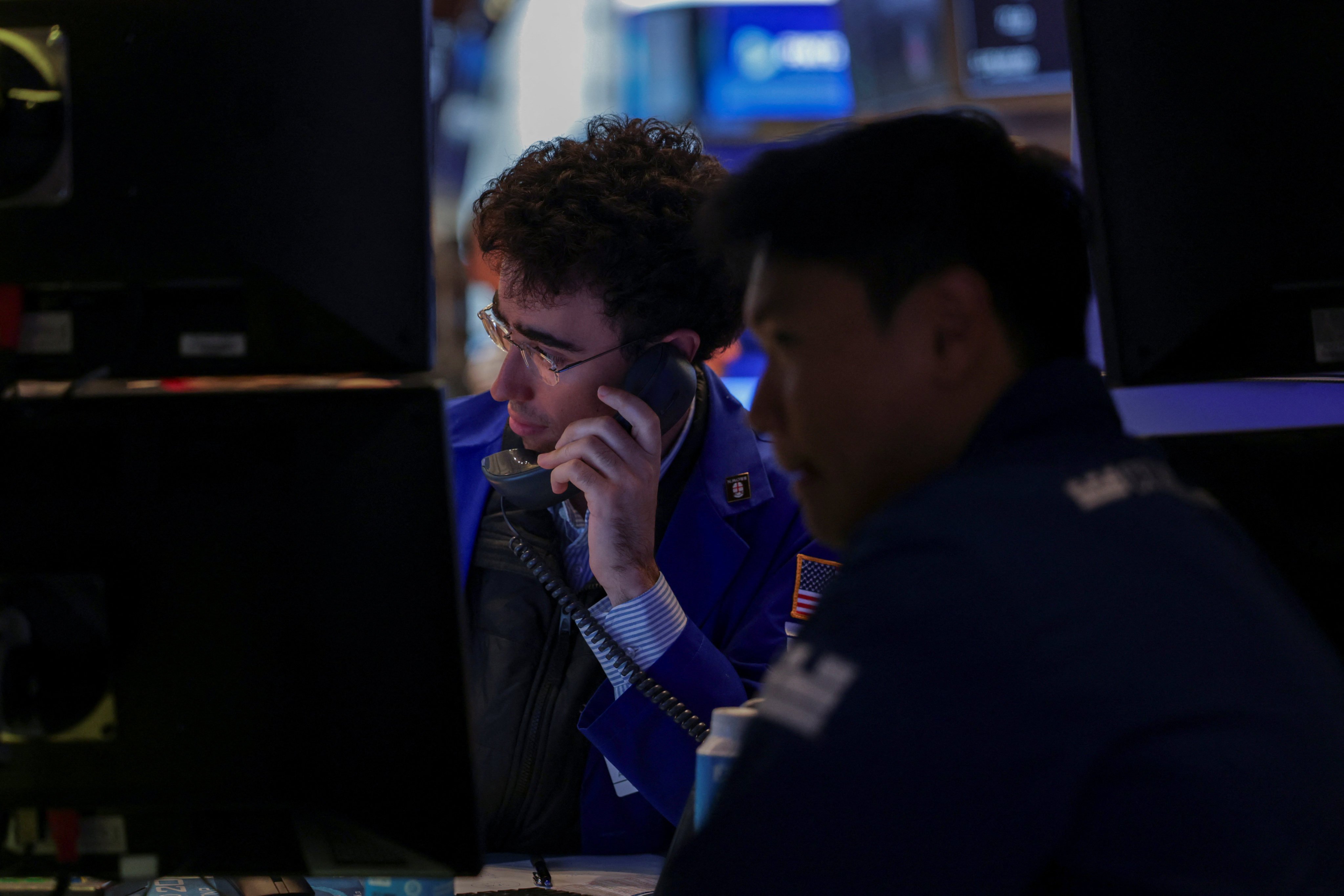 Traders work on the floor at the New York Stock Exchange in New York City, ion June 27. Photo: Reuters