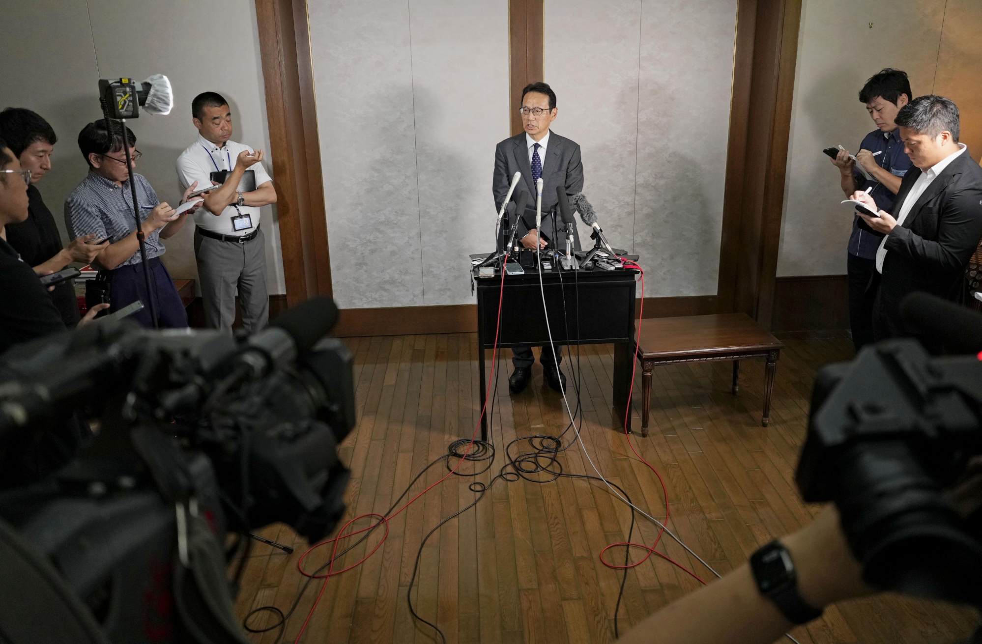 Japanese Ambassador to China Kenji Kanasugi (centre) speaks to reporters in Beijing on Wednesday after a court jailed a Japanese man for spying. Photo: Kyodo