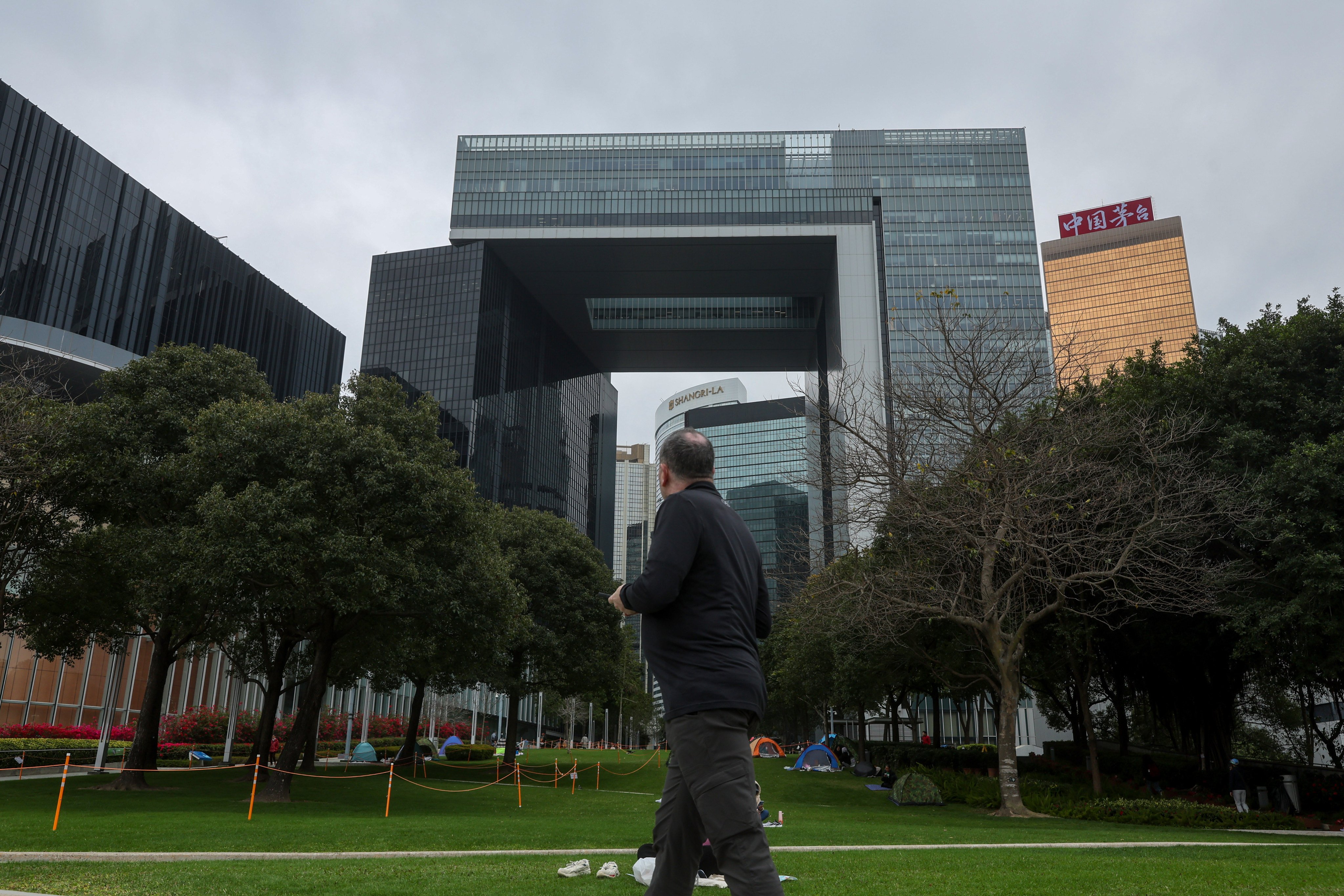 A man walks by the Hong Kong government’s offices in Tamar, Admiralty, on February 22. Photo: Edmond So
