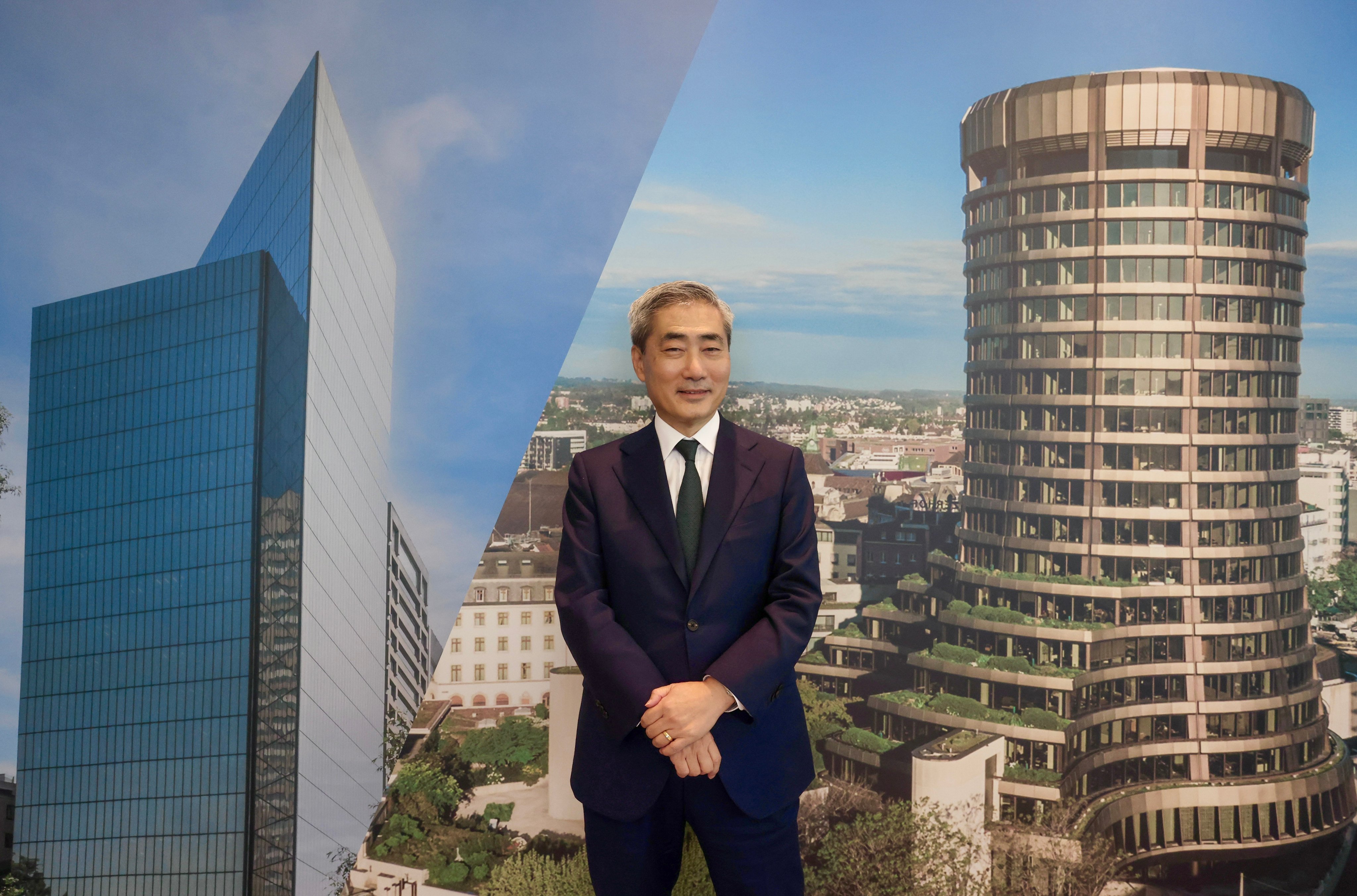 Shin Hyun-Song, economic adviser and the head of the monetary and economic department of the Bank for International Settlements (BIS), during an interview in Hong Kong, with a photo of the bank’s headquarters in Basel, Switzerland, behind him on July 14, 2025. Photo: Jonathan Wong