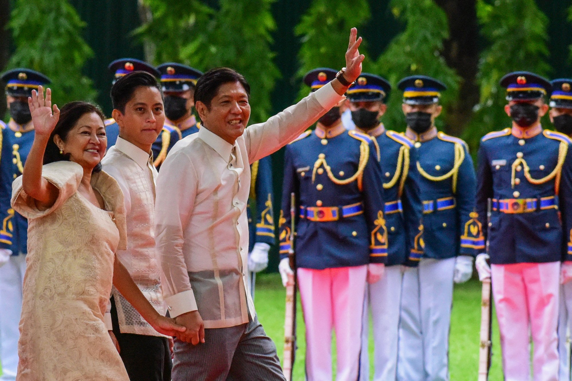 Marcos Jnr and his wife Liza arrive at Malacanang presidential palace in June 2022 accompanied by their son Ferdinand “Sandro” Marcos. Photo: AFP