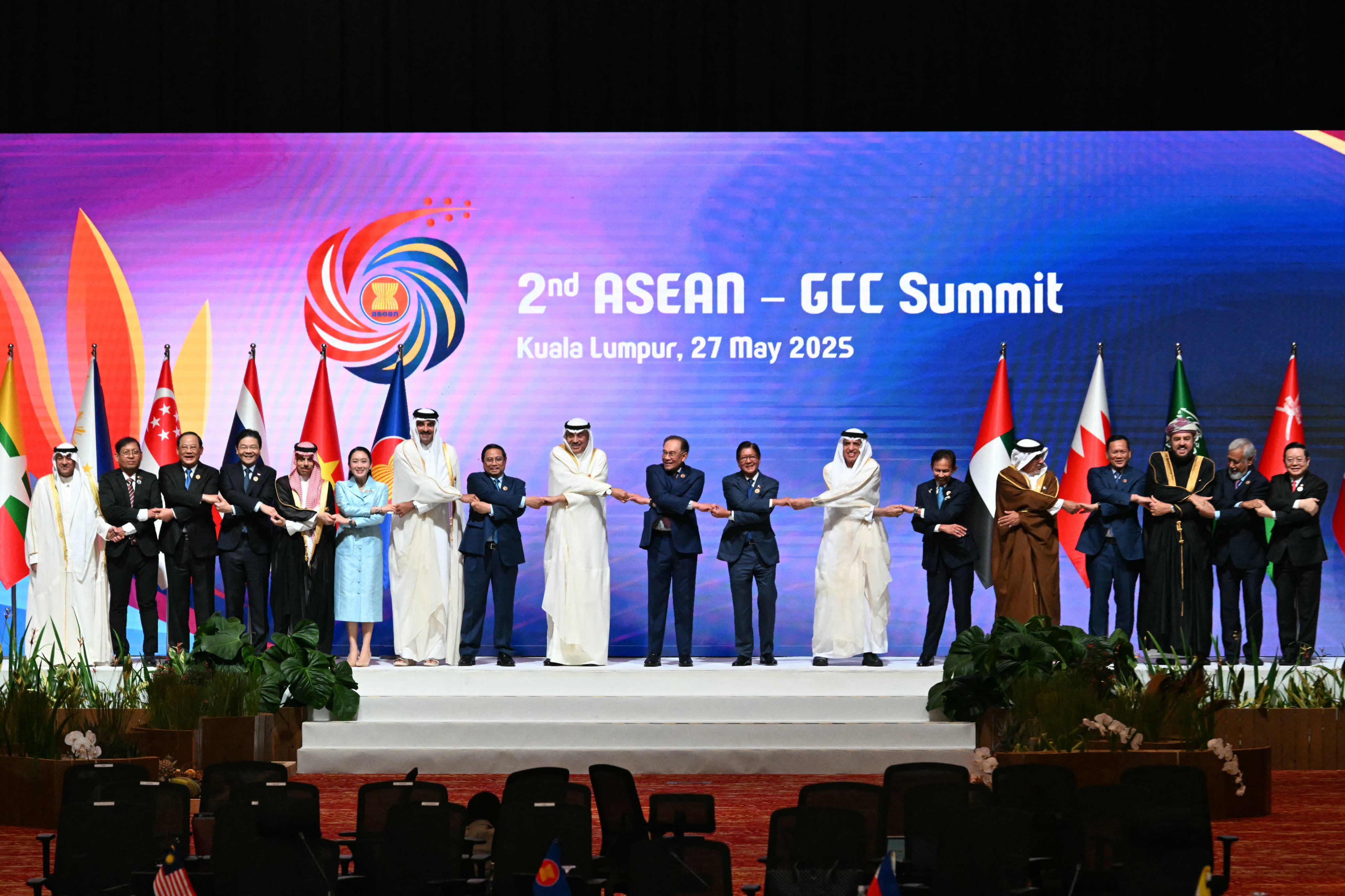 Asean and Gulf officials join hands for a group photo at the second Asean-GCC Summit in Kuala Lumpur on May 27. Photo: AFP