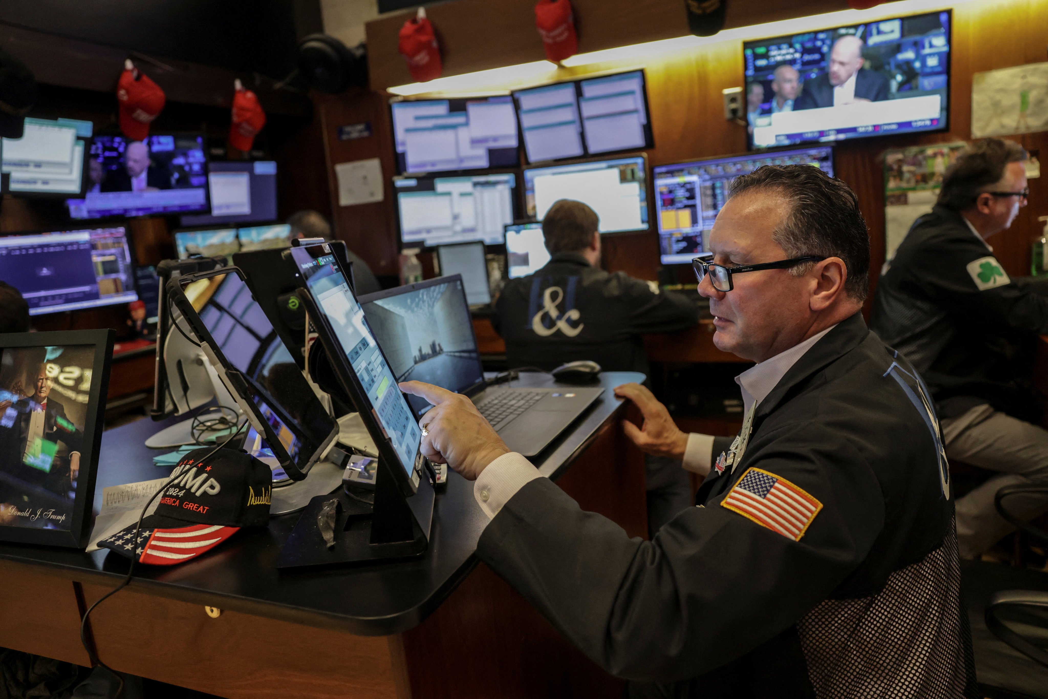 A trader works on the floor at the New York Stock Exchange . Photo: Jeenah Moon