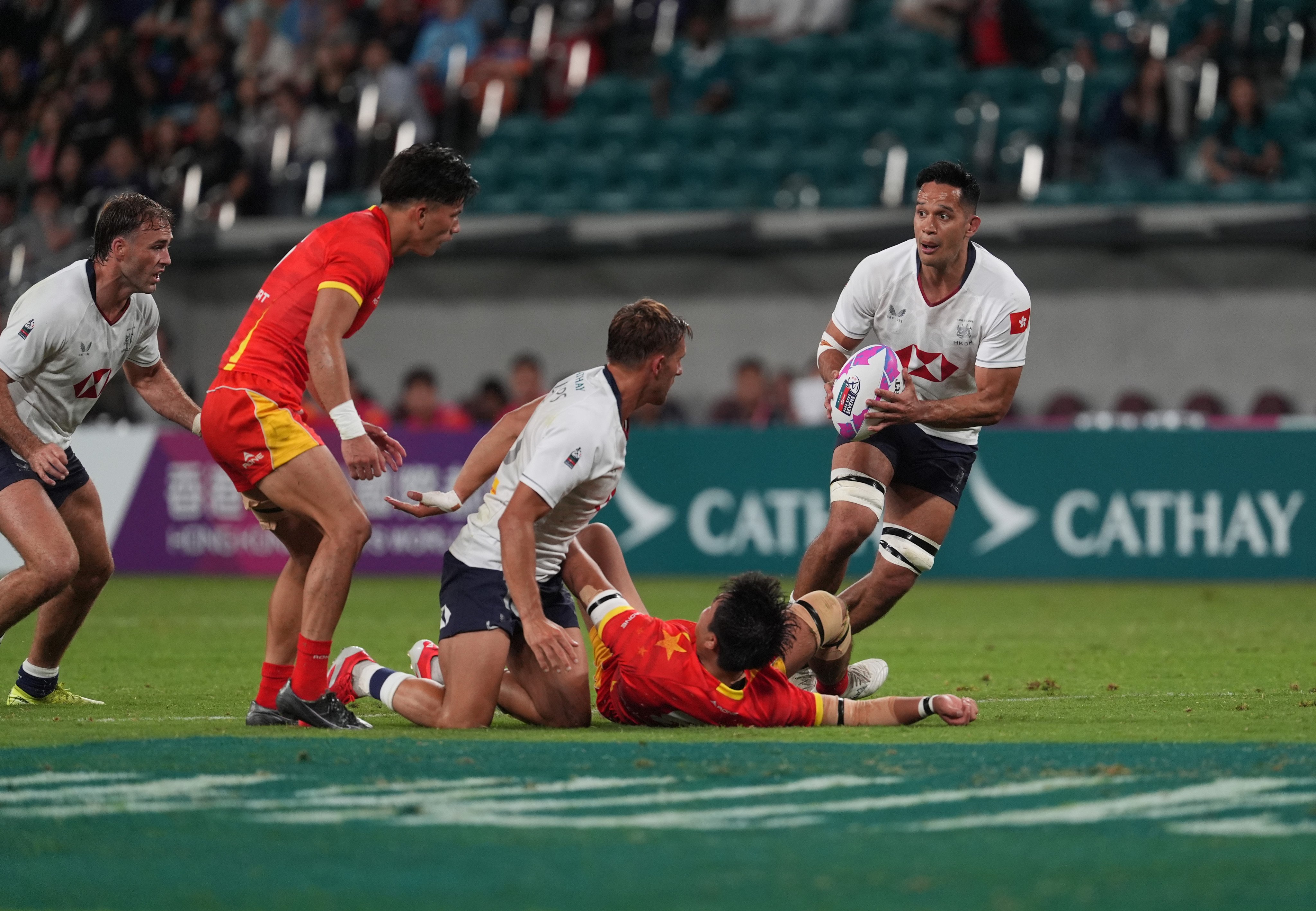 Hong Kong’s Michael Coverdale (right) holds the ball against China. Photo: Elson Li