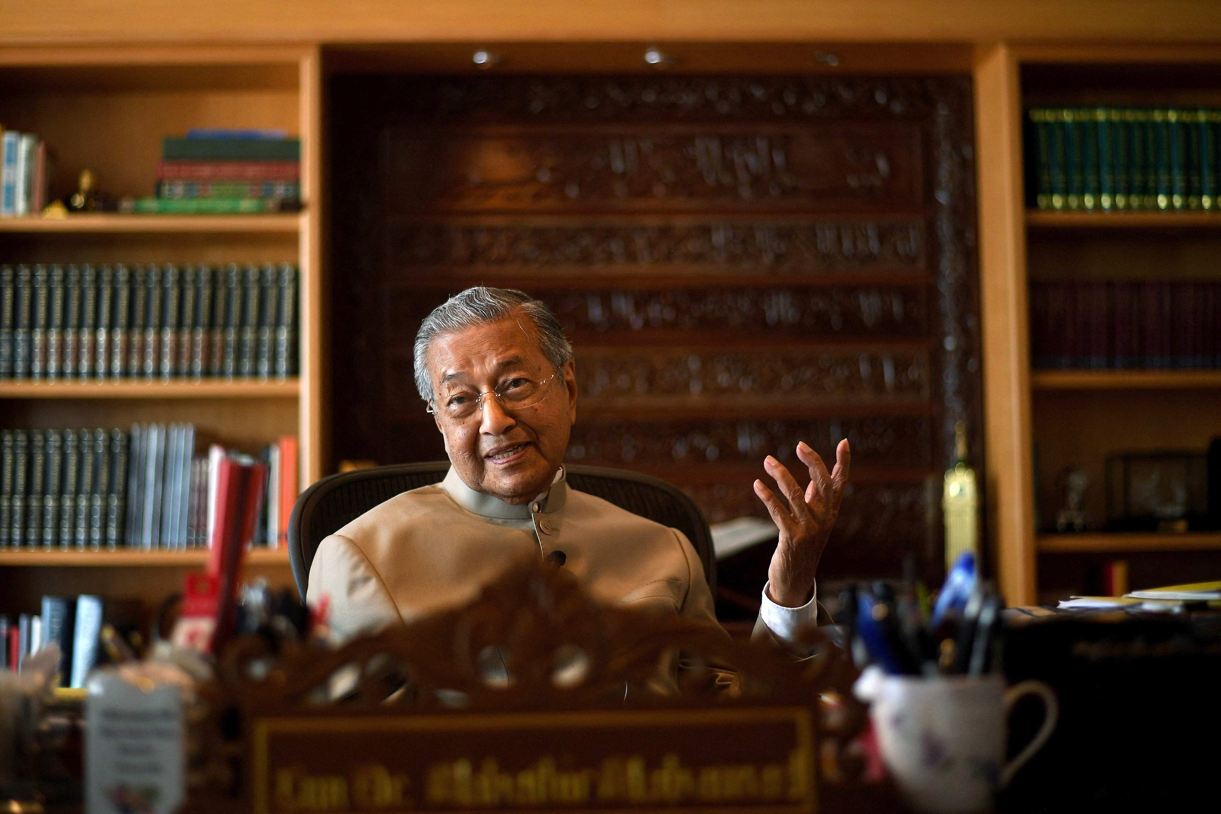 Malaysia’s former prime minister Mahathir Mohamad gestures during an interview at his office in Putrajaya. Photo: AFP