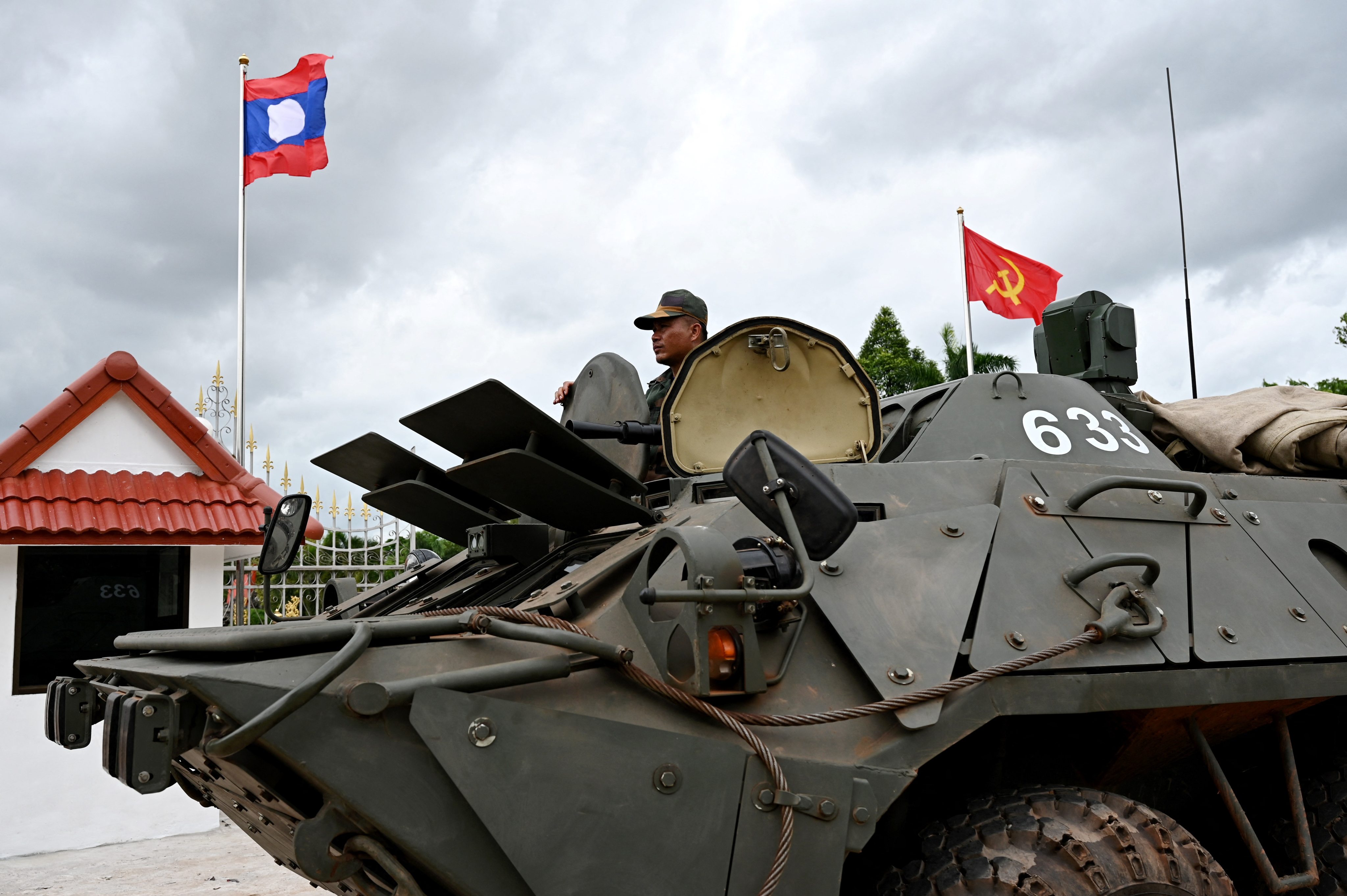 A Laotian soldier looks on from an armoured vehicle  during the Asean Foreign Ministers’ Meeting in Vientiane last year. Photo:   AFP