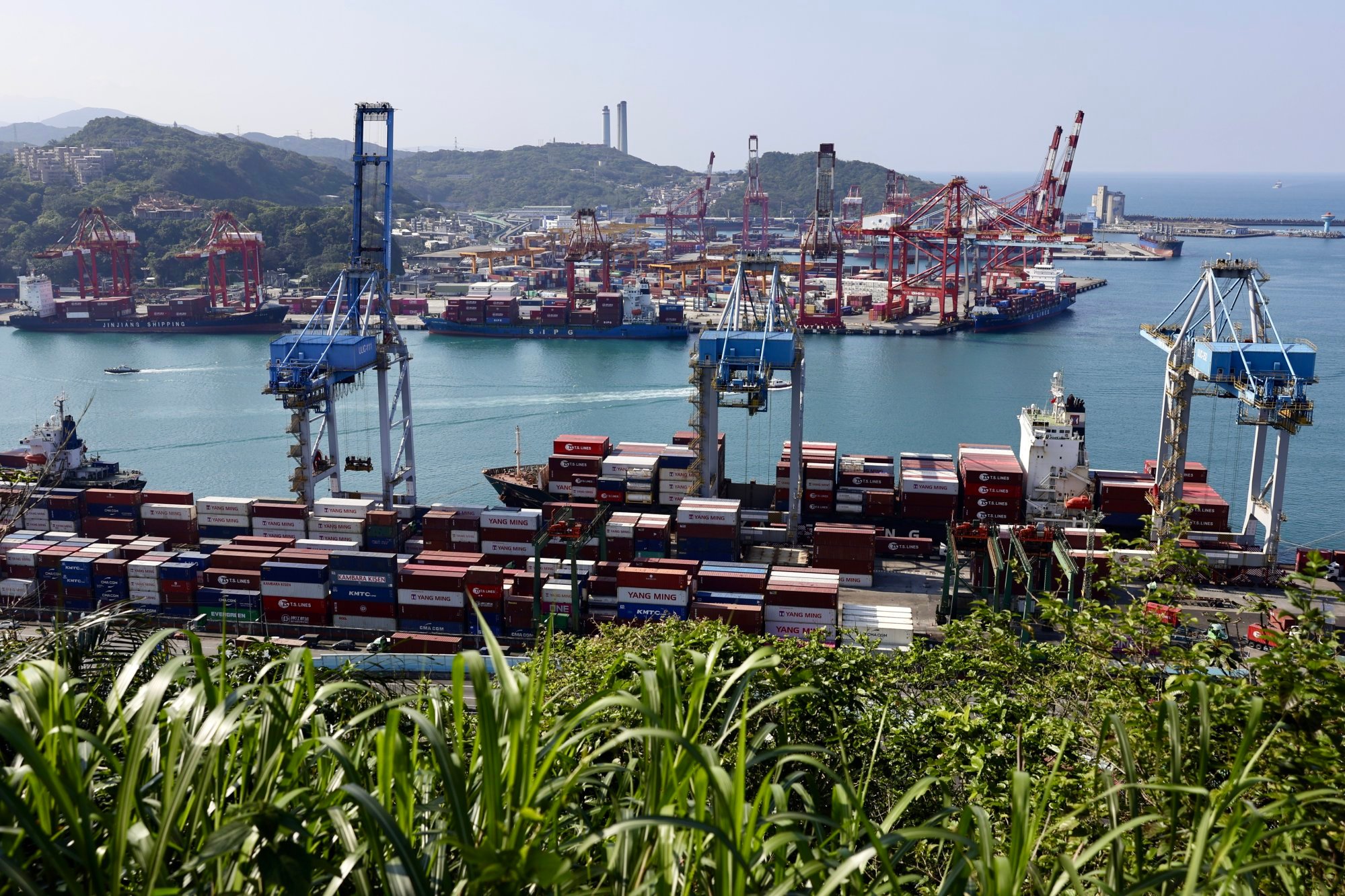 Shipping containers are stacked on cargo ships in the port city of Keelung, Taiwan, on March 20. Photo: EPA-EFE Shipping containers are stacked on cargo ships in the port city of Keelung, Taiwan, on March 20. Photo: EPA-EFE