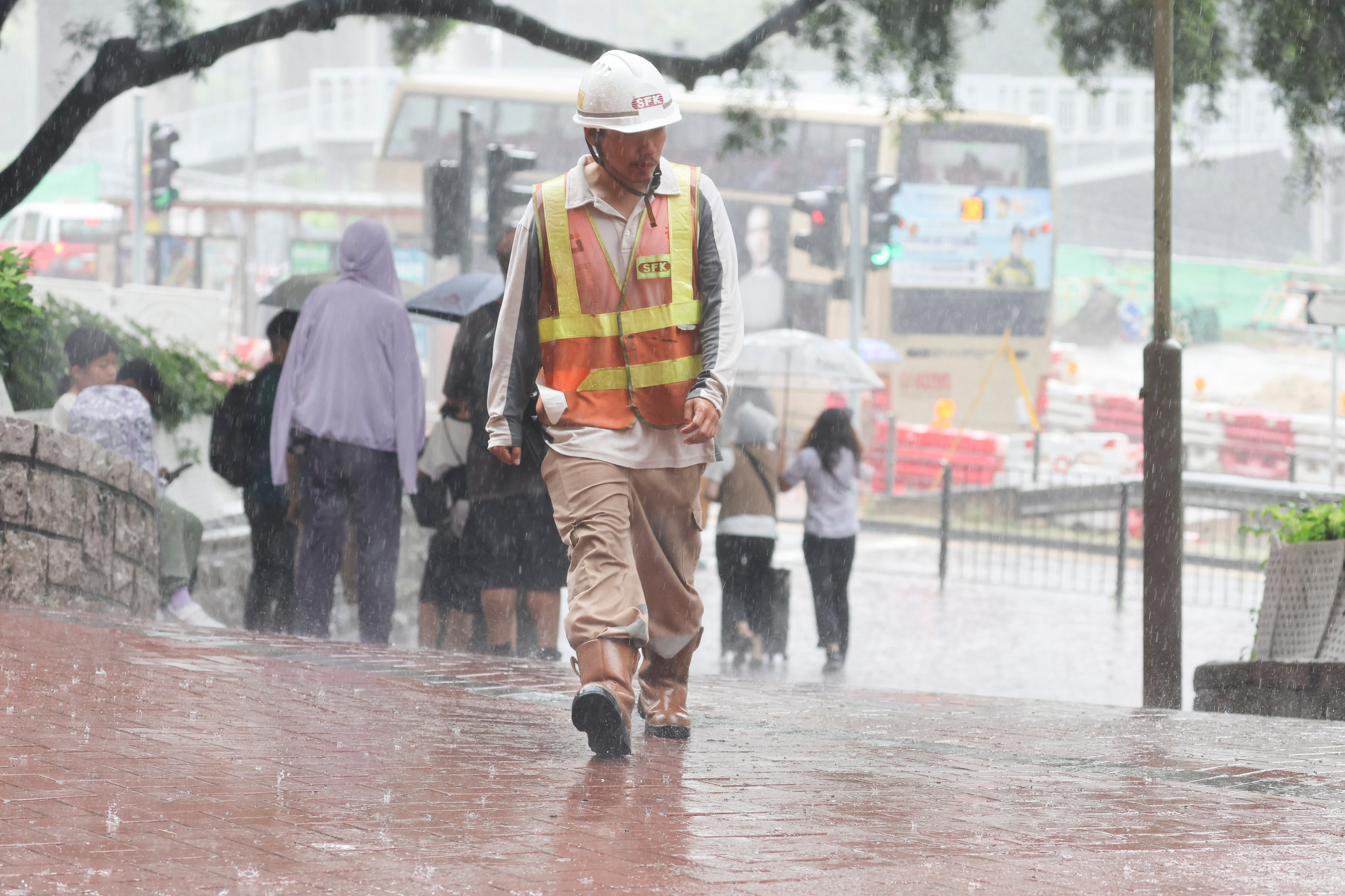 Residents walk through heavy rain in the Diamond Hill area on Friday. Photo: Edmond So
