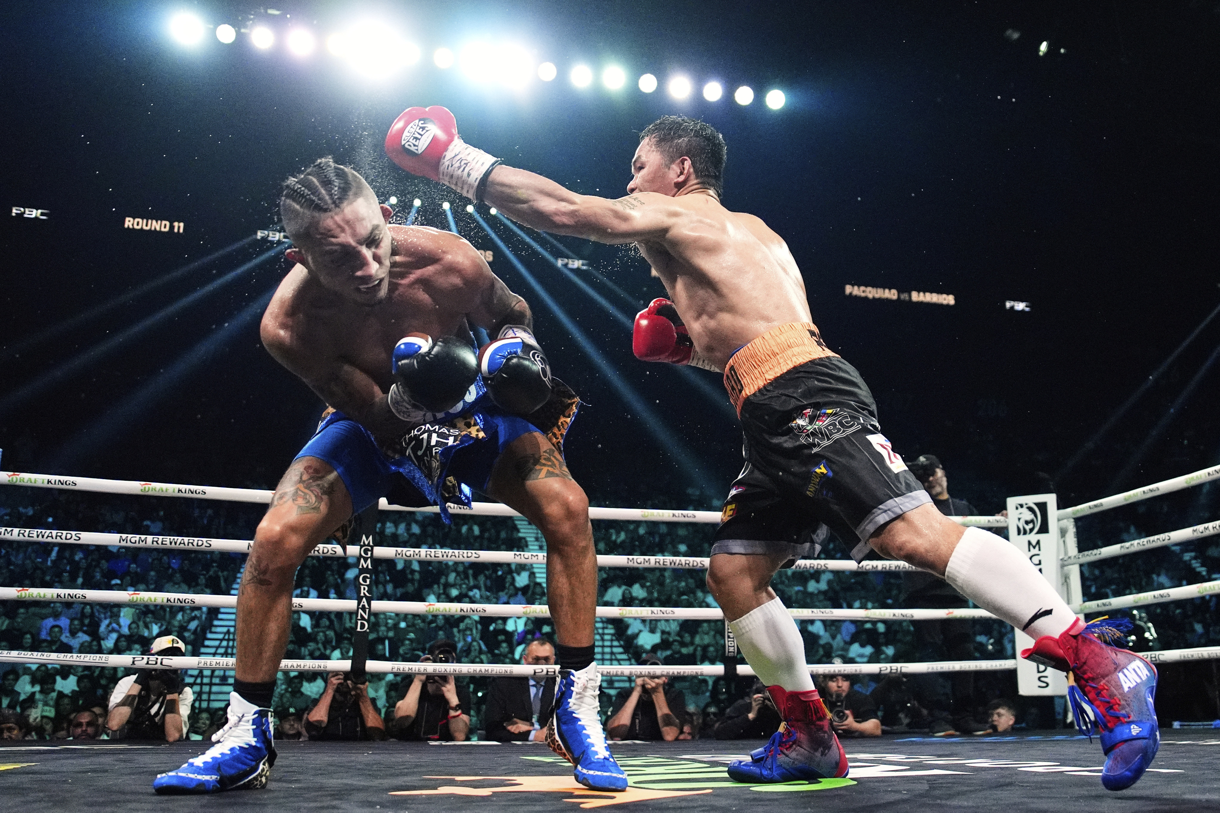 Mario Barrios (left) ducks away from a Manny Pacquiao punch in their welterweight title fight in Las Vegas. Photo: AP