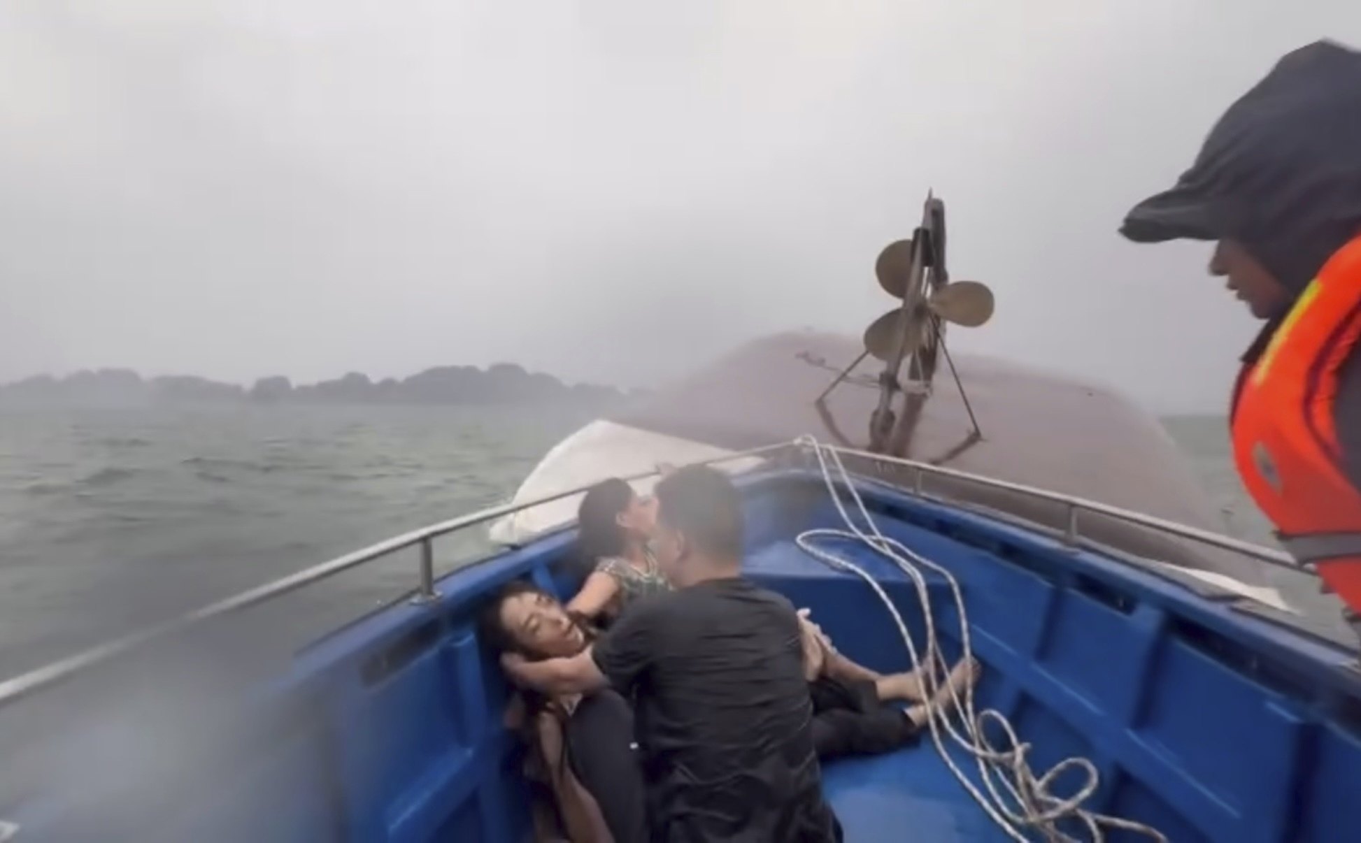 People on a rescue boat after their tourist boat capsized in Ha Long Bay, Vietnam on Saturday. Photo: QDND/AP