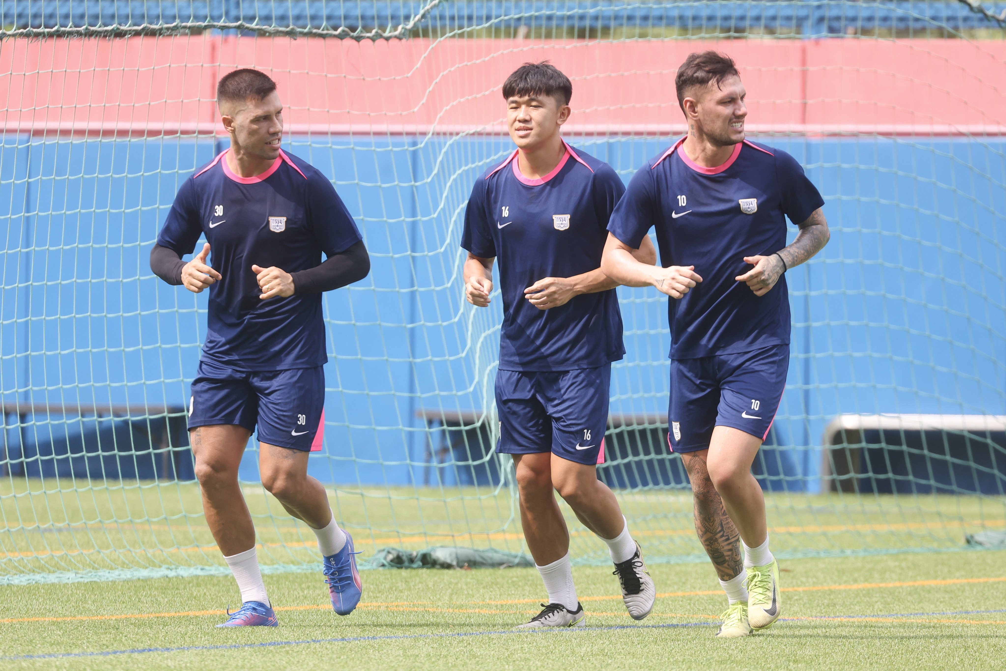 Tan Chun-lok (middle) training with Kitchee teammates Juninho (left) and Kendy Ikegami. Photo: Edmond So