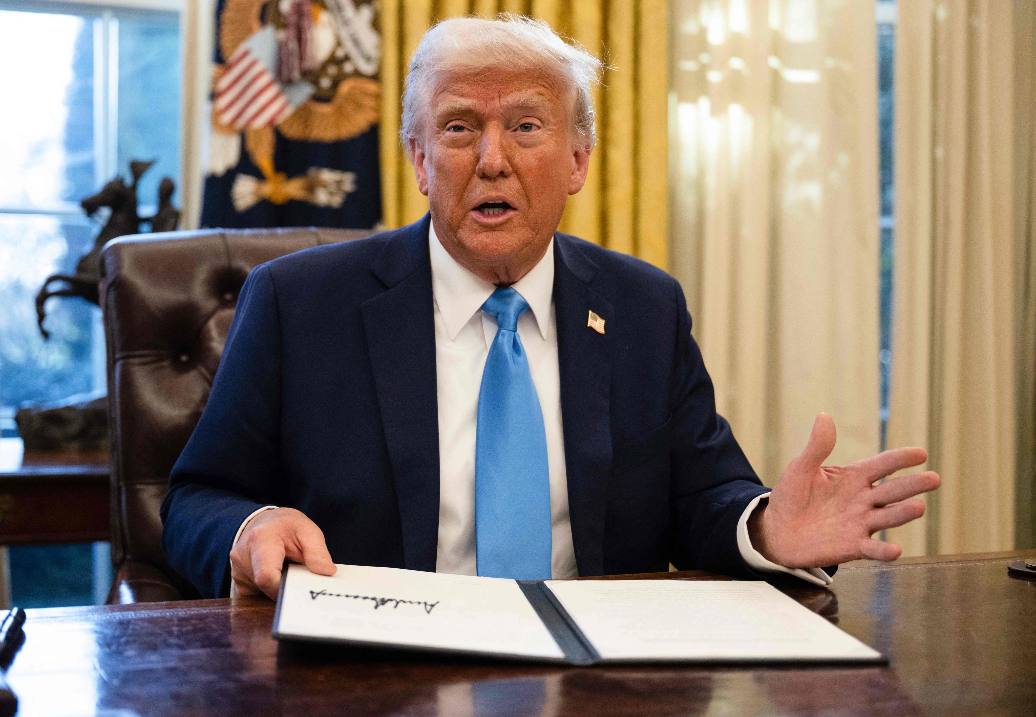 US President Donald Trump speaks to the press after signing an executive order withdrawing his country from a number of United Nations bodies on February 4. Photo: AFP