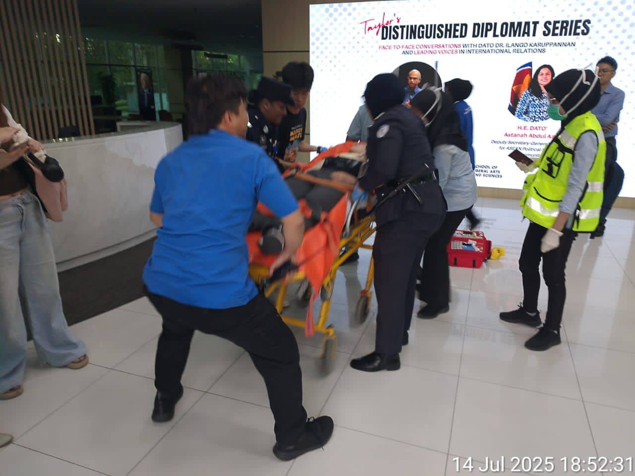 A photo released by Malaysian police shows the victim of a knife attack being rushed to hospital for treatment on July 14. Photo: Handout