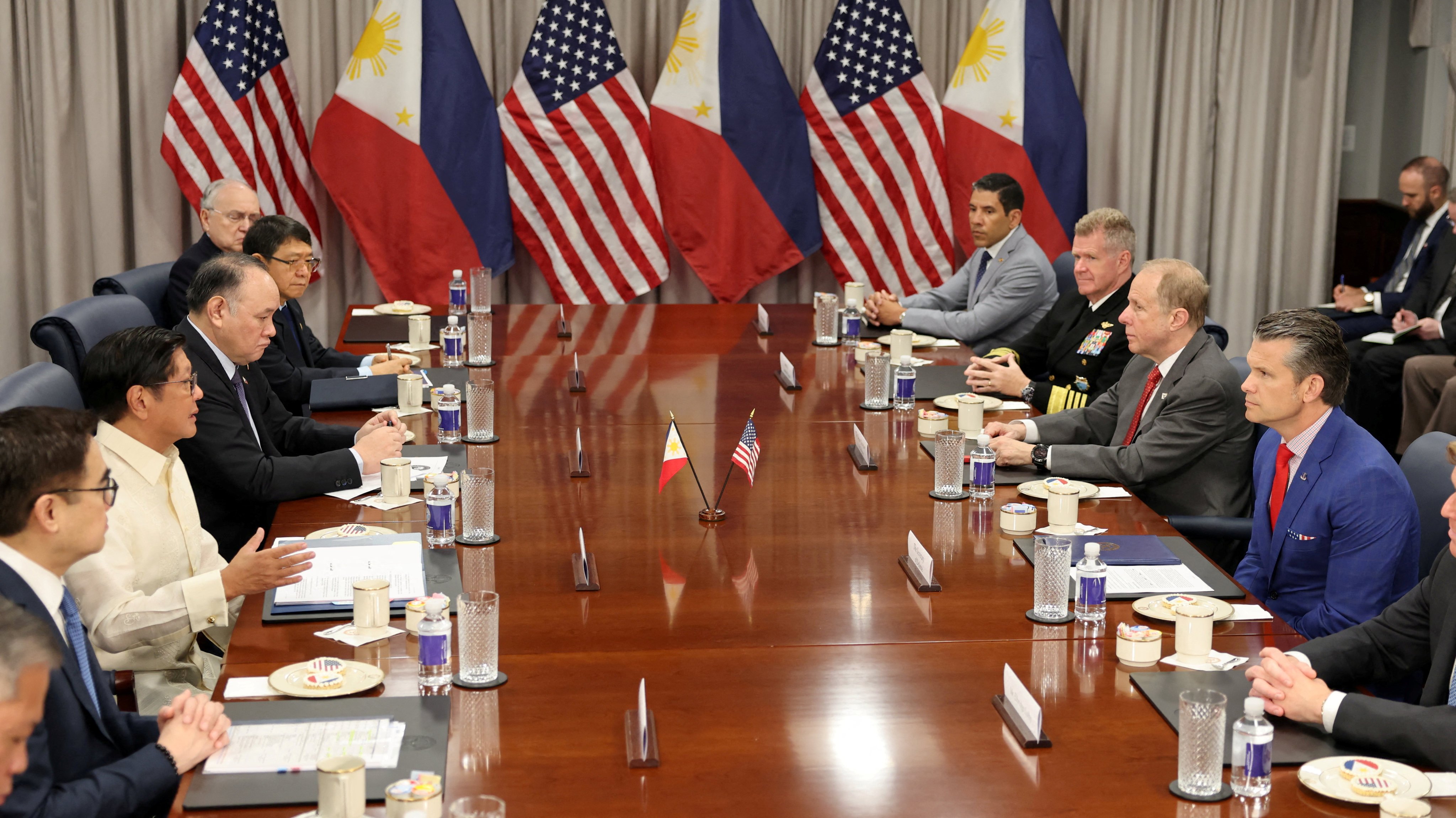 Philippine President Ferdinand Marcos Jnr (left, without jacket) speaking with US Defense Secretary Pete Hegseth at the Pentagon on Monday. Photo: Reuters