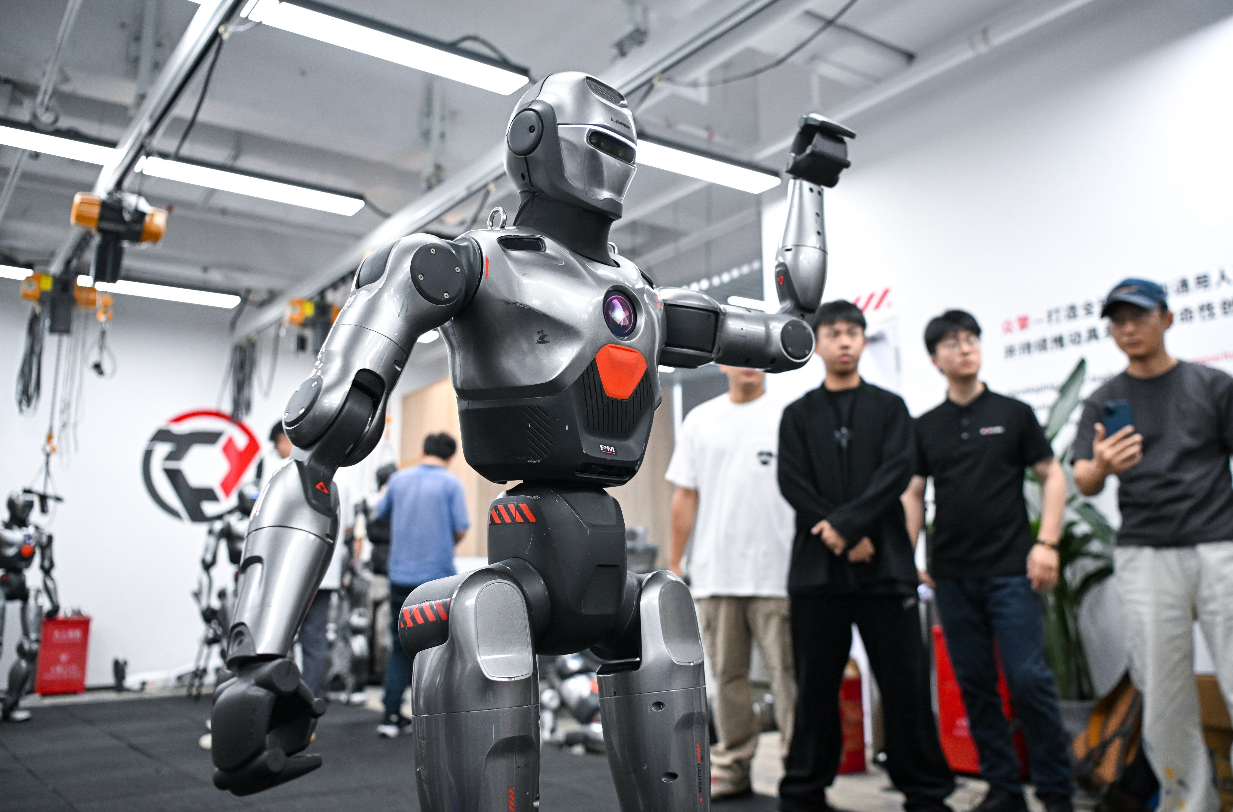 A humanoid robot waves at onlookers during a demonstration in China’s southern tech hub of Shenzhen last month. Photo: Xinhua