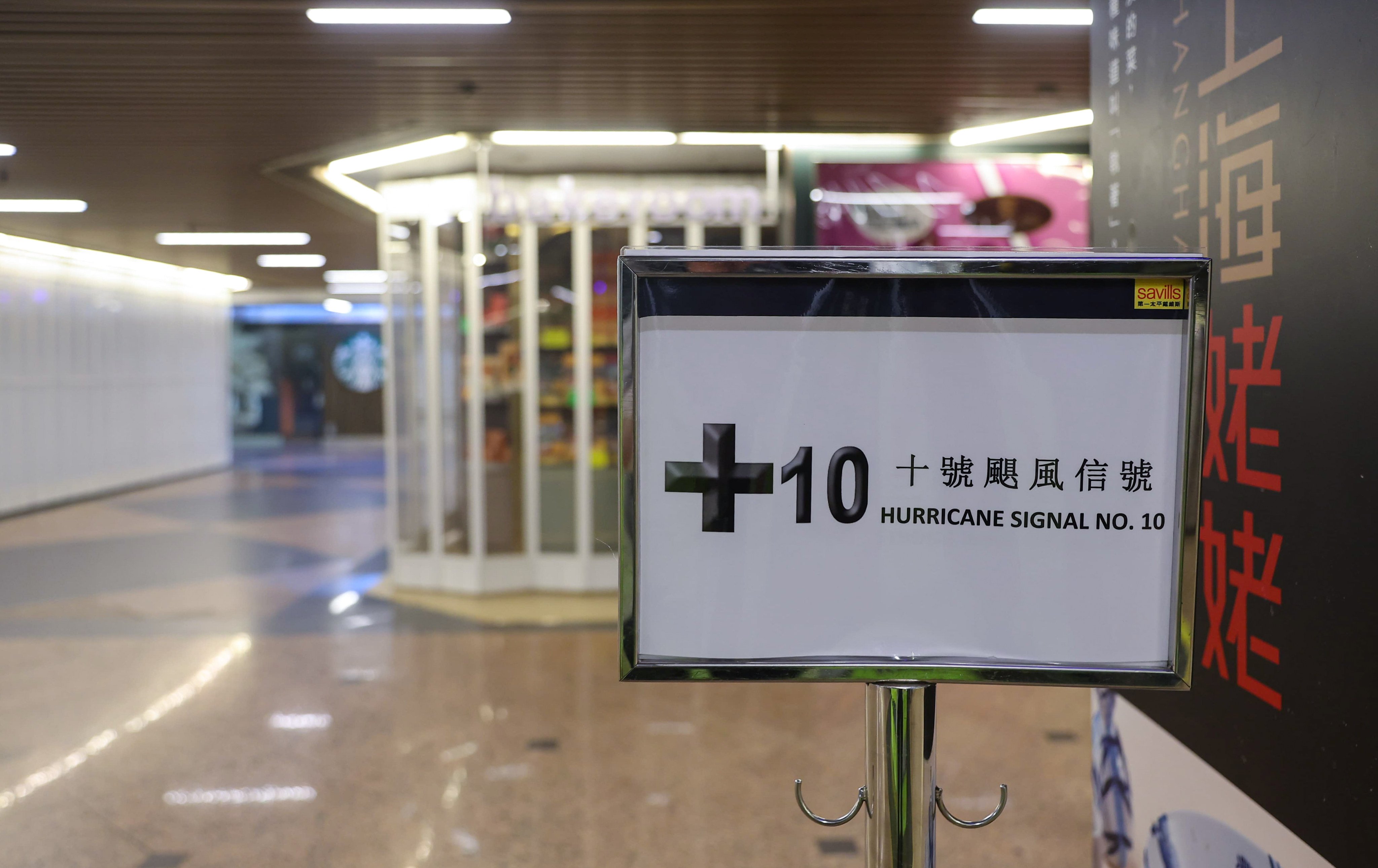 A sign at an empty shopping centre in Tsim Sha Tsui on Sunday warns a T10 signal is in effect on Sunday. Photo: Edmond So