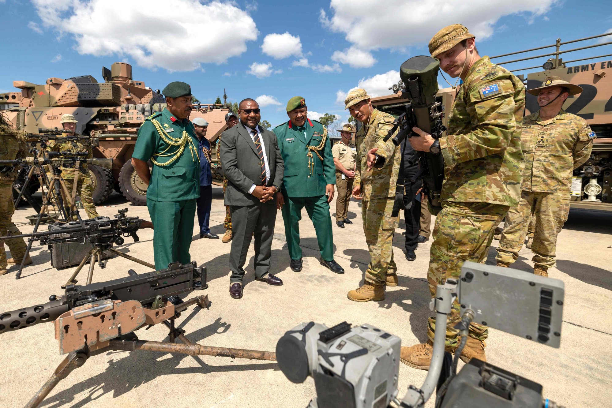 PNG Defence Minister Billy Joseph (second from left) and officials talk to Australlian troops during a visit to a Brisbane barracks earlier this year amid talks on a defence pact. Photo: Australian Defence Force/AFP