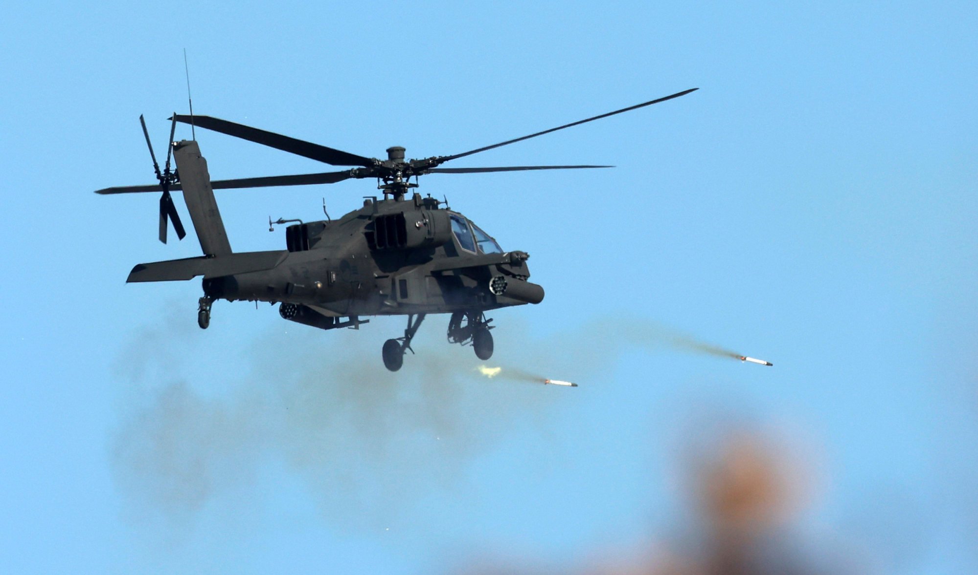 A South Korean army’s Apache helicopter fires rockets during a joint drill between South Korea and the US at a field in Pocheon in March. Photo: AP