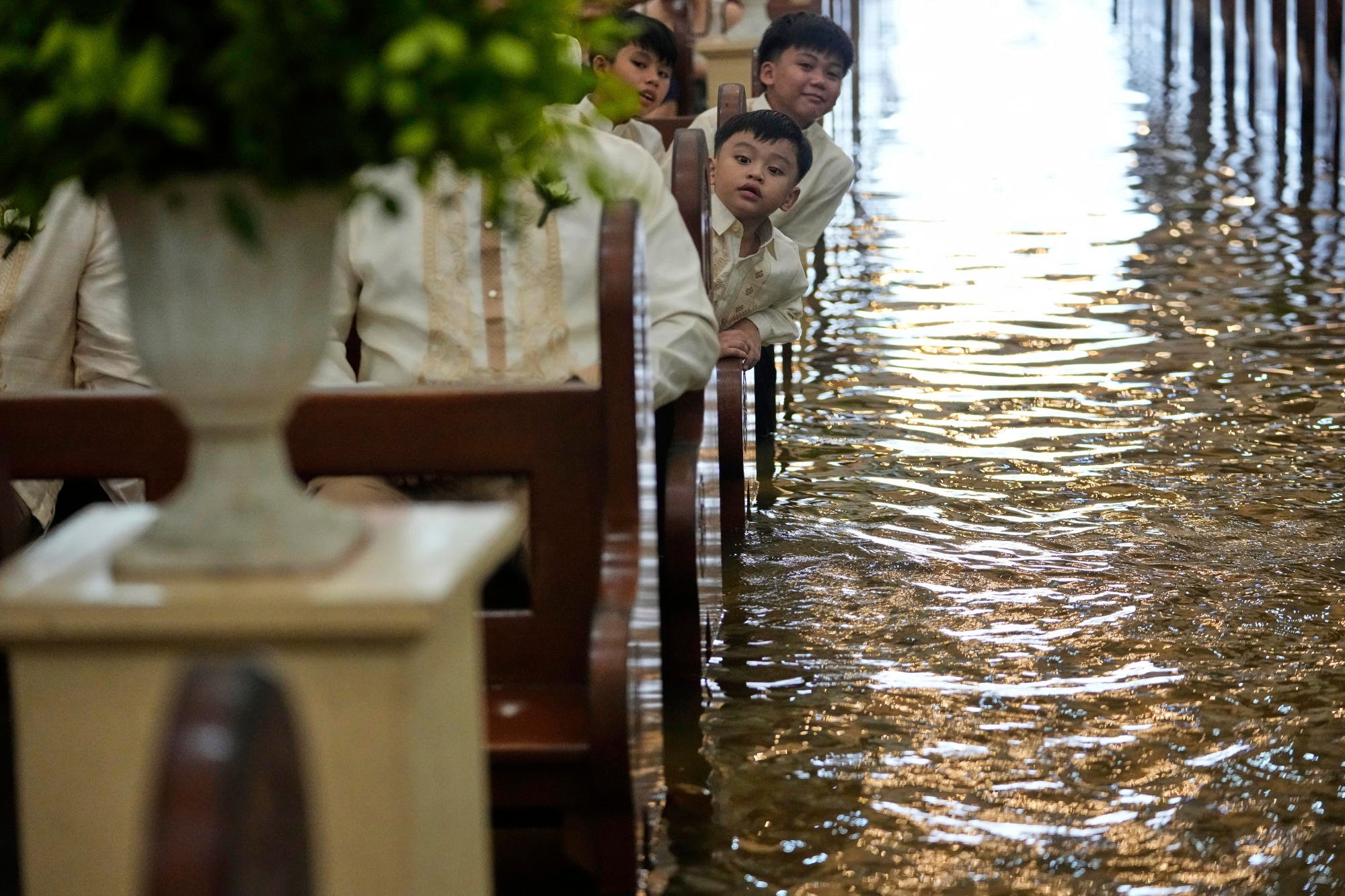 A flooded Barasoain church in Malolos, Bulacan, Philippines where a wedding took place on Tuesday. Photo: AP A flooded Barasoain church in Malolos, Bulacan, Philippines where a wedding took place on Tuesday. Photo: AP