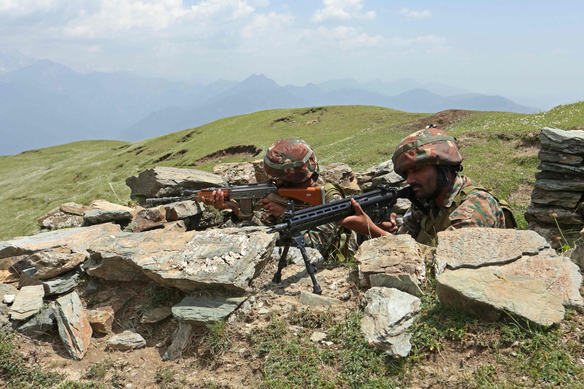 Indian soldiers keep watch at a border area between Pakistan and India, in a sector of India’s Jammu region. Photo: AFP