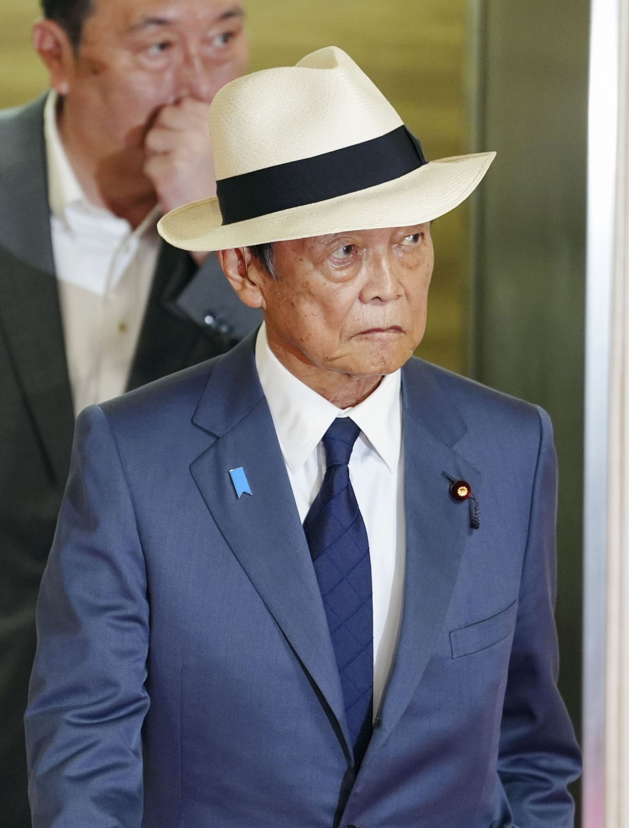 Former Japanese Prime Minister Taro Aso heads for a meeting with Ishiba and other party executives at LDP headquarters in Tokyo on Wednesday. Photo: Kyodo