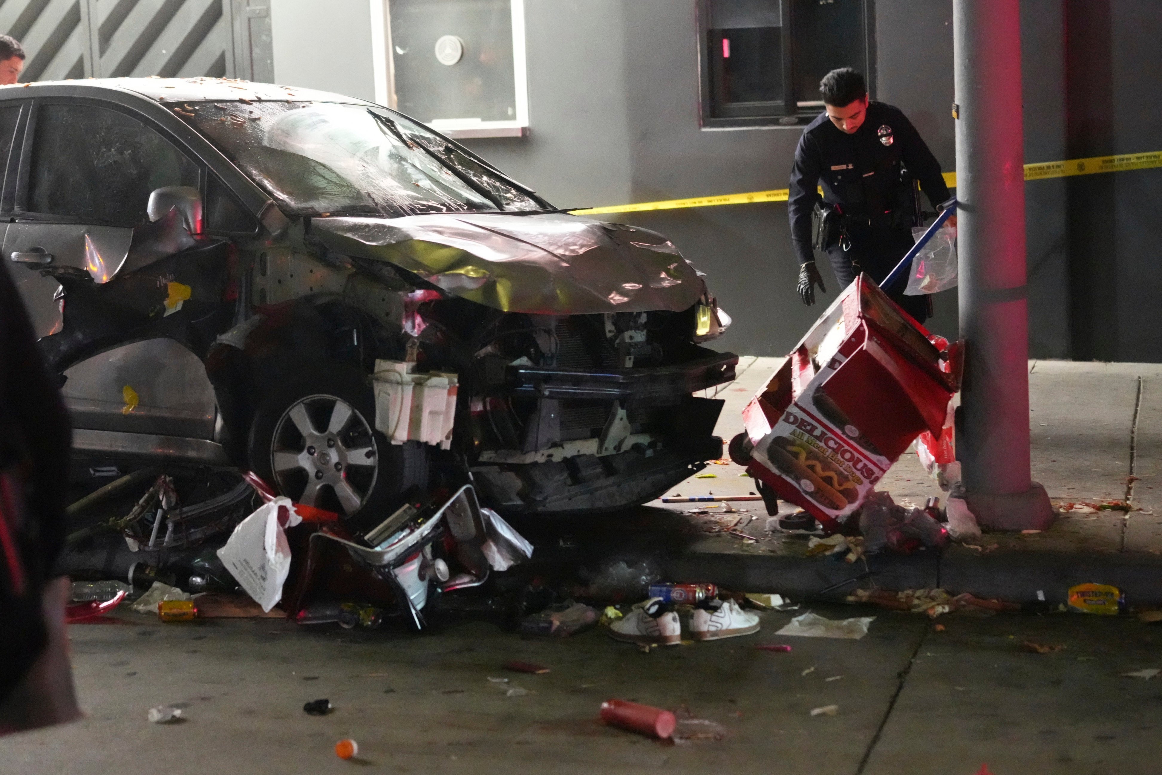 A vehicle sits on the pavement after ramming into a crowd of people waiting to enter a nightclub along a busy boulevard in Los Angeles on July 19. Photo: AP