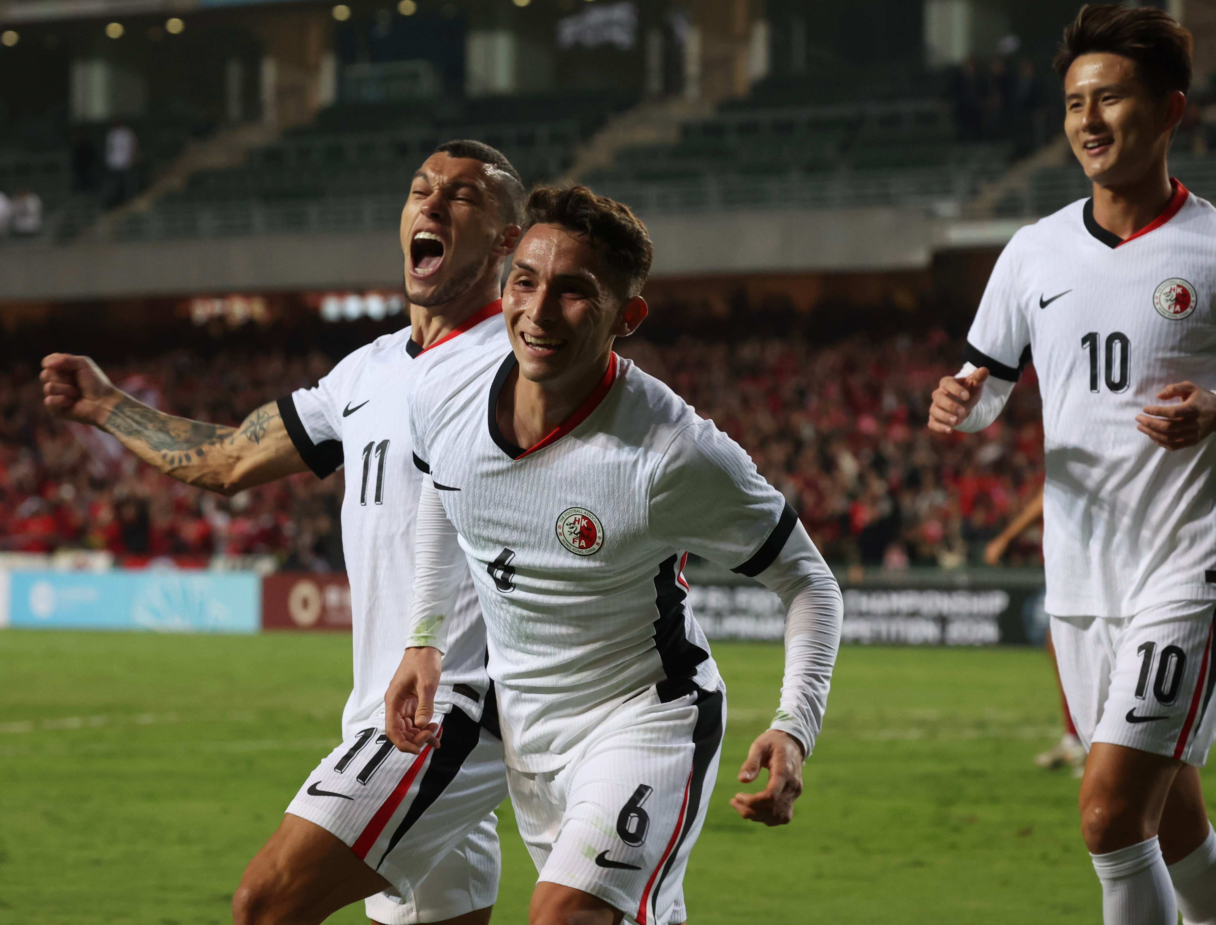 Nicholas Benavides (middle) celebrates scoring for Hong Kong against Guam last December. Photo: Dickson Lee