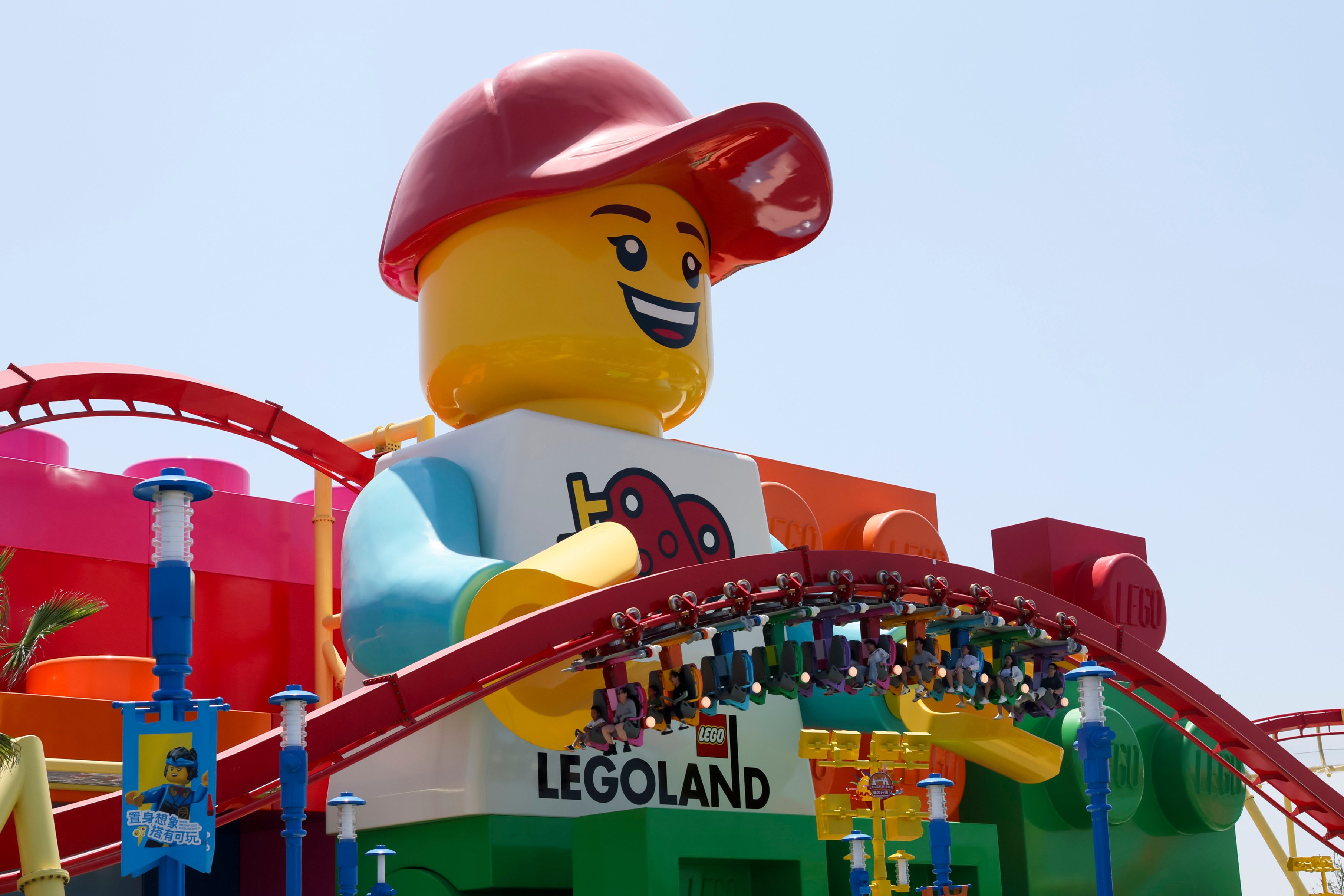 Visitors ride a roller coaster ride at the Legoland Shanghai Resort, China’s first Legoland. Photo: Xinhua