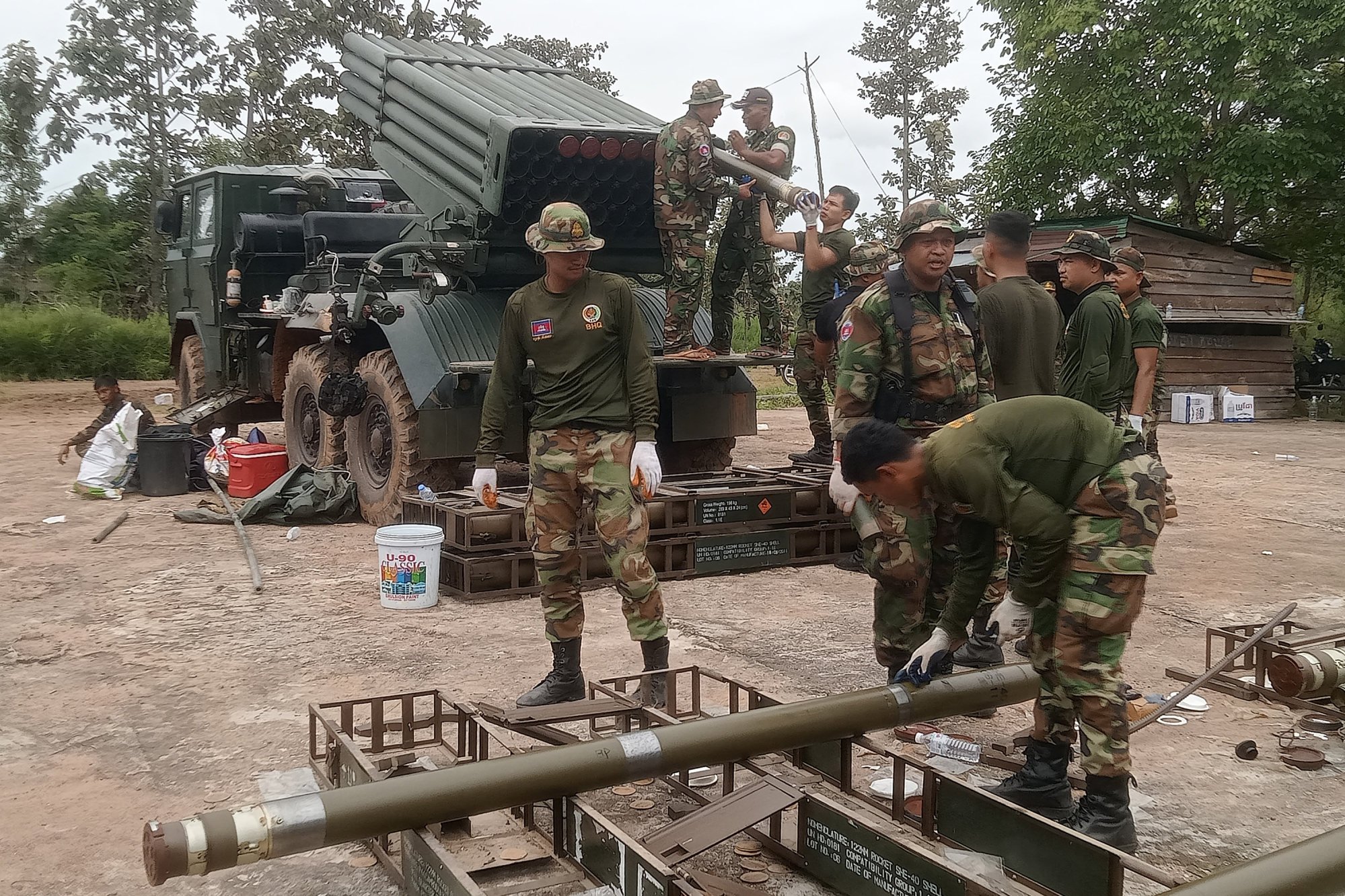 Cambodian soldiers reload the BM-21 multiple rocket launcher in Preah Vihear province on Thursday. At least 12 people have been killed in recent fighting between Thai and Cambodian troops along their border. Photo: TNS Cambodian soldiers reload the BM-21 multiple rocket launcher in Preah Vihear province on Thursday. At least 12 people have been killed in recent fighting between Thai and Cambodian troops along their border. Photo: TNS