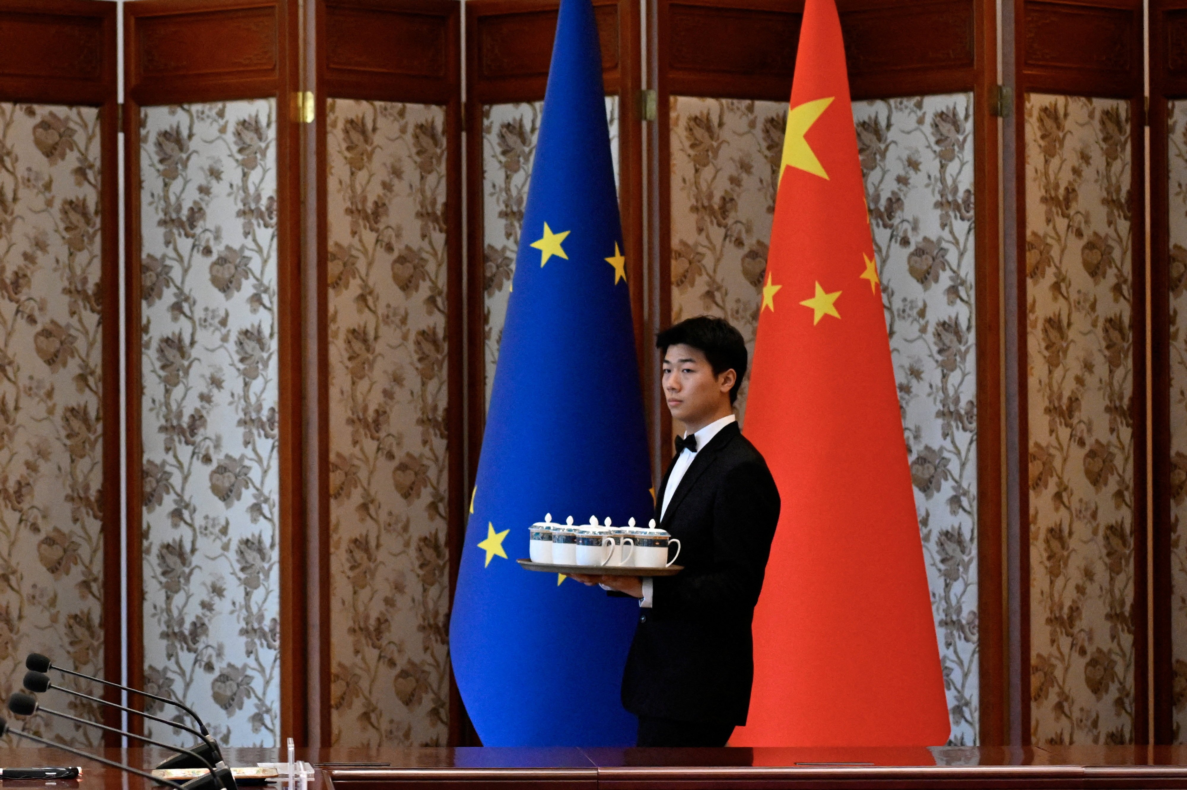 Staff prepare for a China-European Union forum on environmental policy in Beijing. Climate change and the green transition remain key areas of cooperation for the two powers. Photo: Reuters