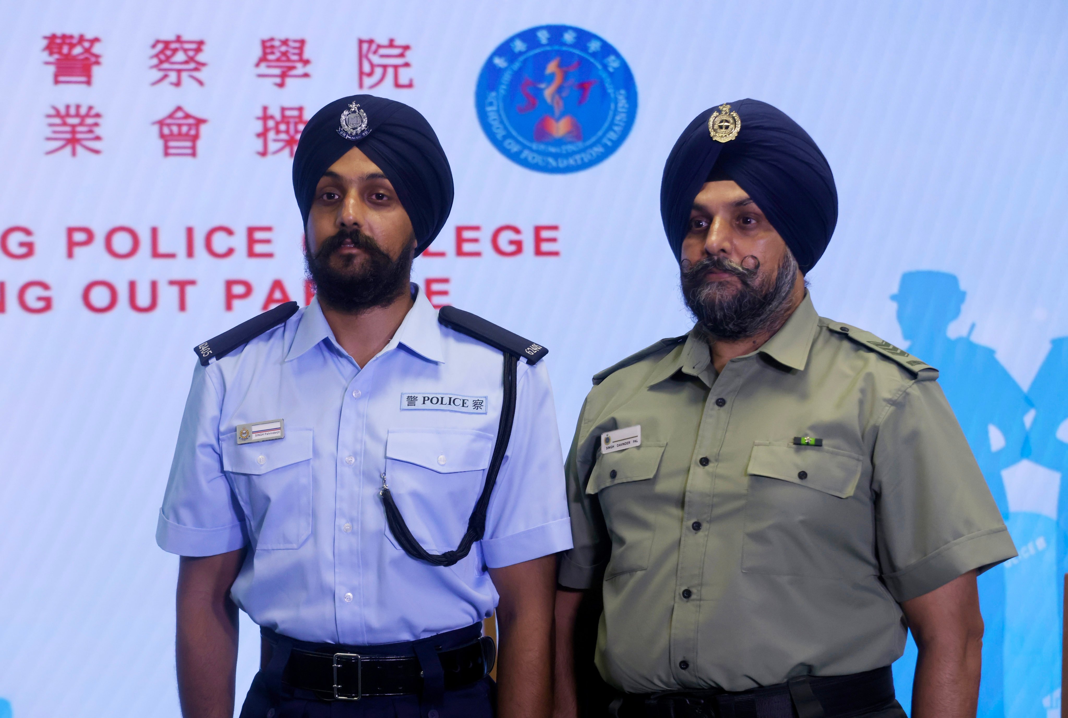 Police constable Palvinderjit Singh and his father, Assistant Officer of the Correctional Services Department Davinder-pal Singh. Photo: Jonathan Wong