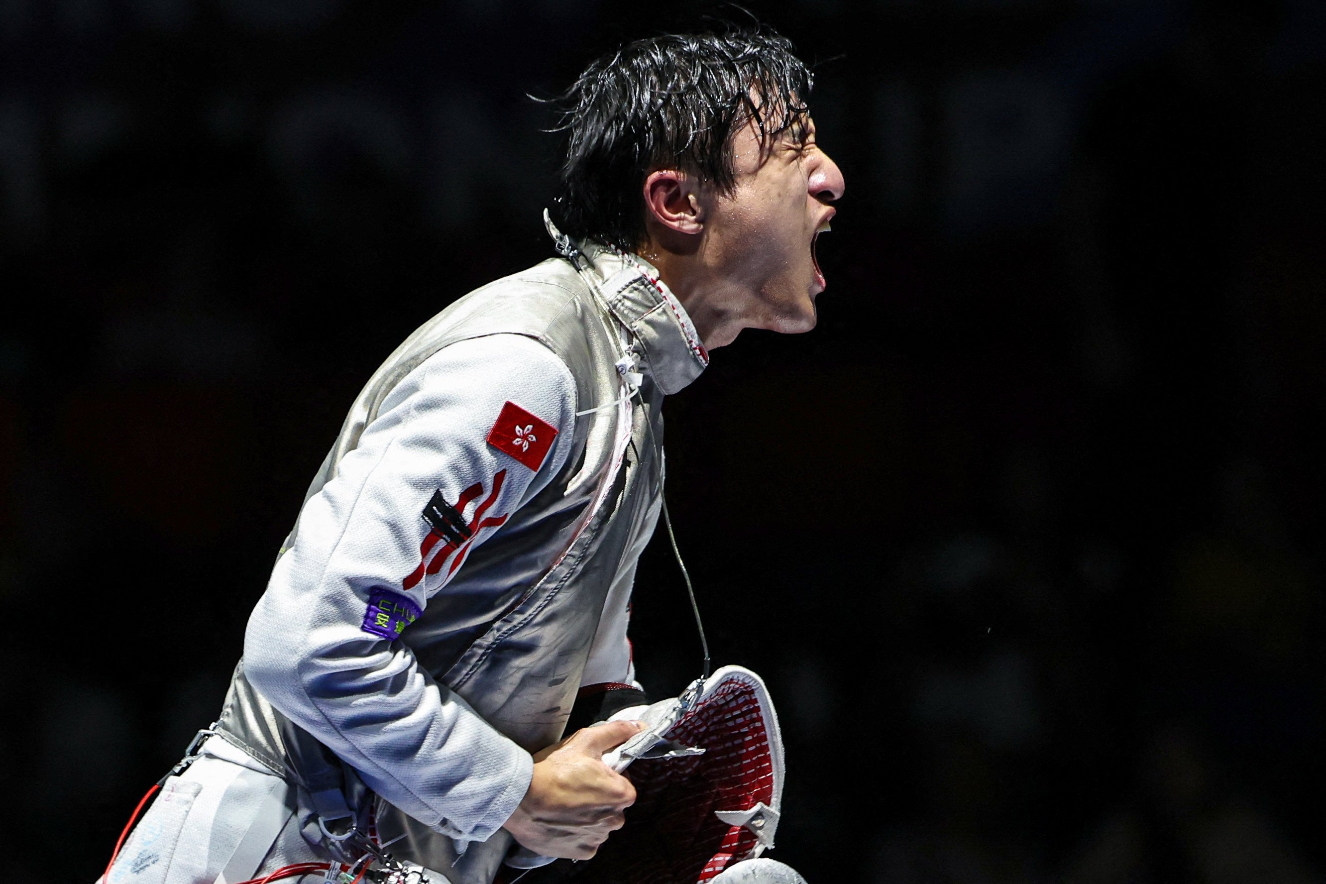 Hong Kong’s Ryan Choi Chun-yin celebrates winning against Individual Neutral Athlete Kirill Borodachev in the men’s foil individual gold medal bout during the FIE Fencing World Championships in Tbilisi on July 23. Photo: AFP