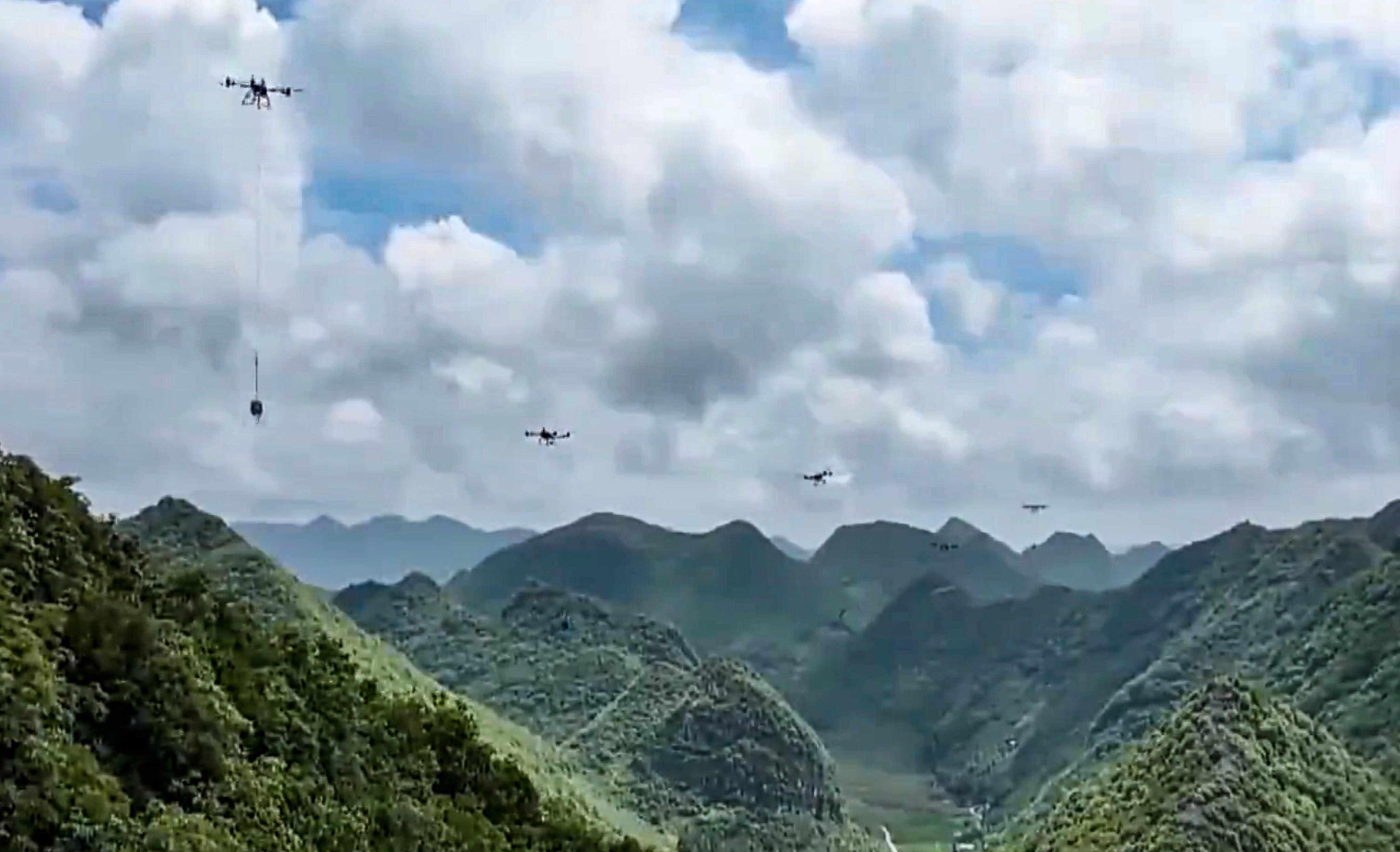 Heavy-lift drones, seen here in footage from state broadcaster CCTV, transport materials to build  electricity transmission towers in a mountainous area of Yunnan province in southwest China. Photo: CCTV