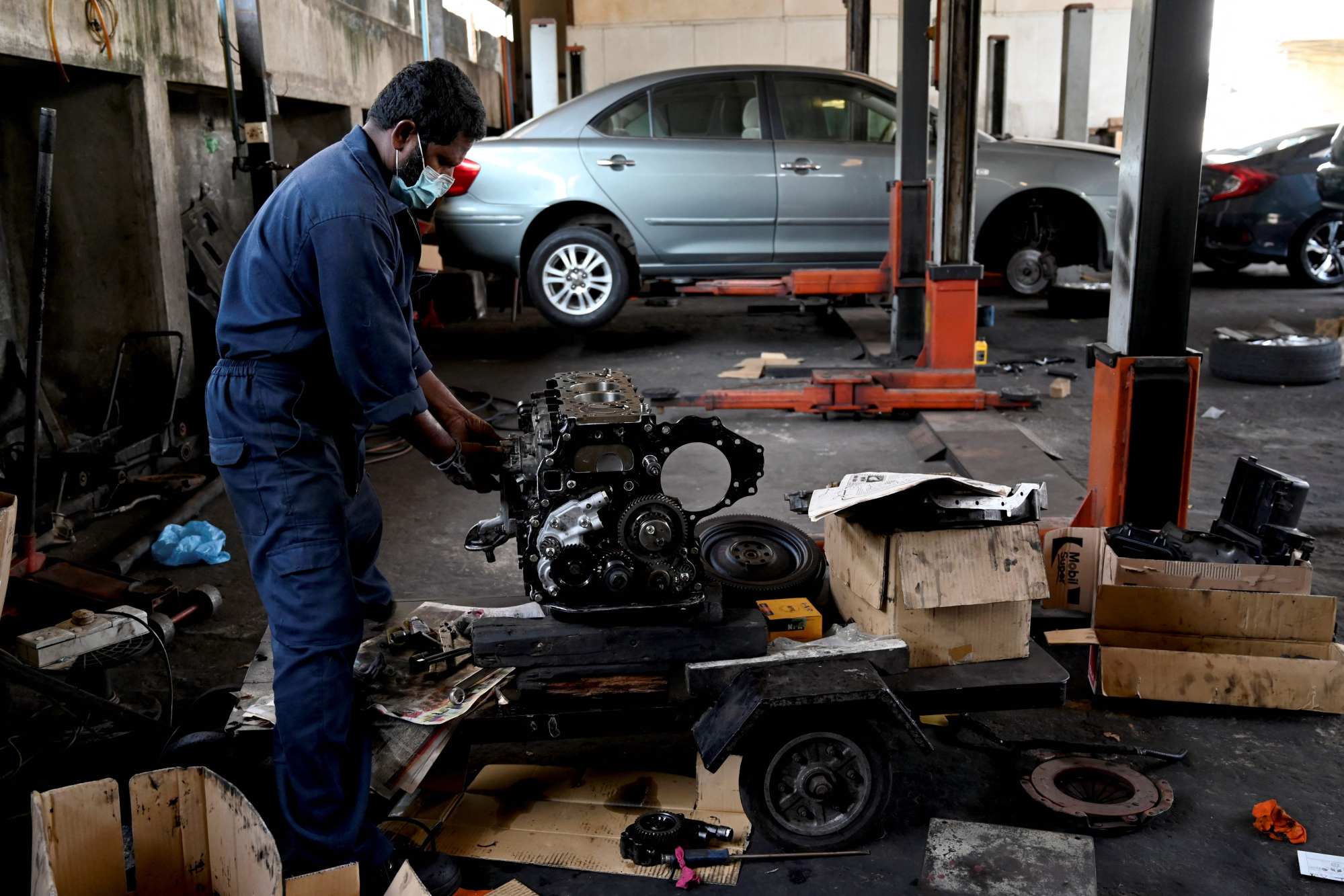 A mechanic works on a car at a garage in Colombo. Sri Lanka’s car market largely caters to the wealthiest 5 per cent of households. Photo: AFP