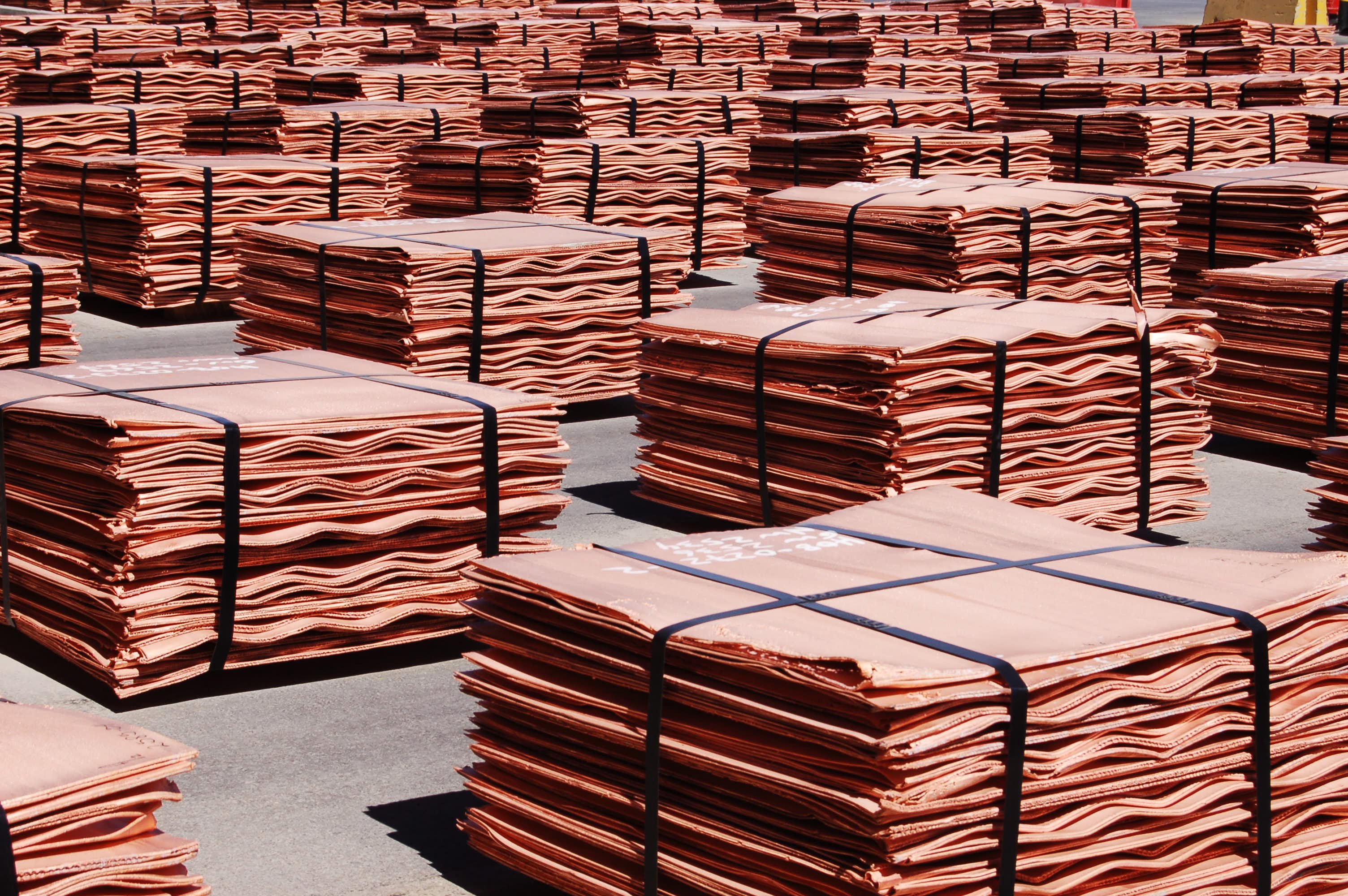 Sheets of pure copper sit in stacks outside a plant awaiting shipment. The US continues to rely heavily on imports of copper, while also exporting large amounts of scrap metal. Photo: Getty Images
