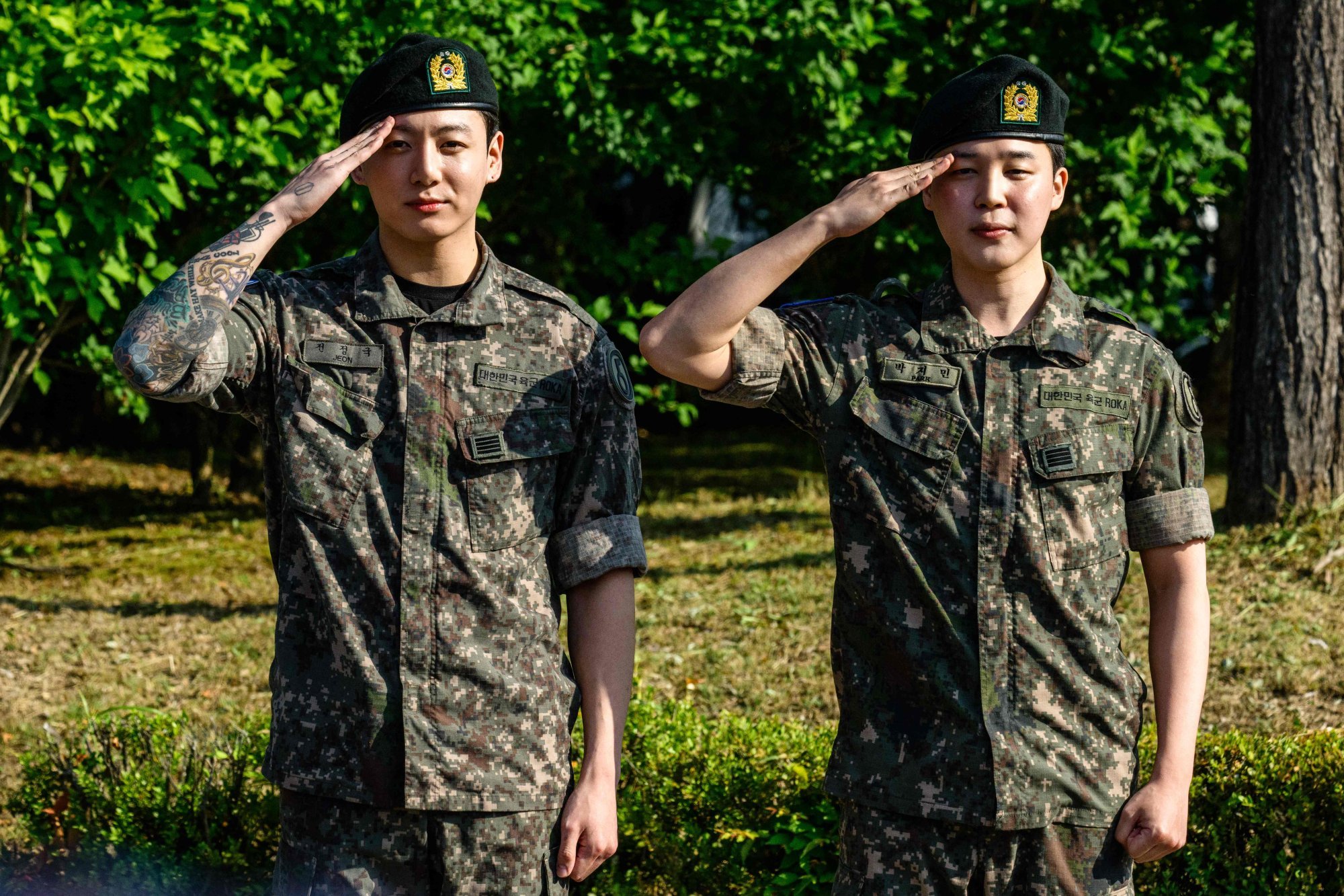 BTS members Jungkook and Jimin salute for the media and fans in June shortly after their release from 18 months of mandatory military service in South Korea. Photo: AFP