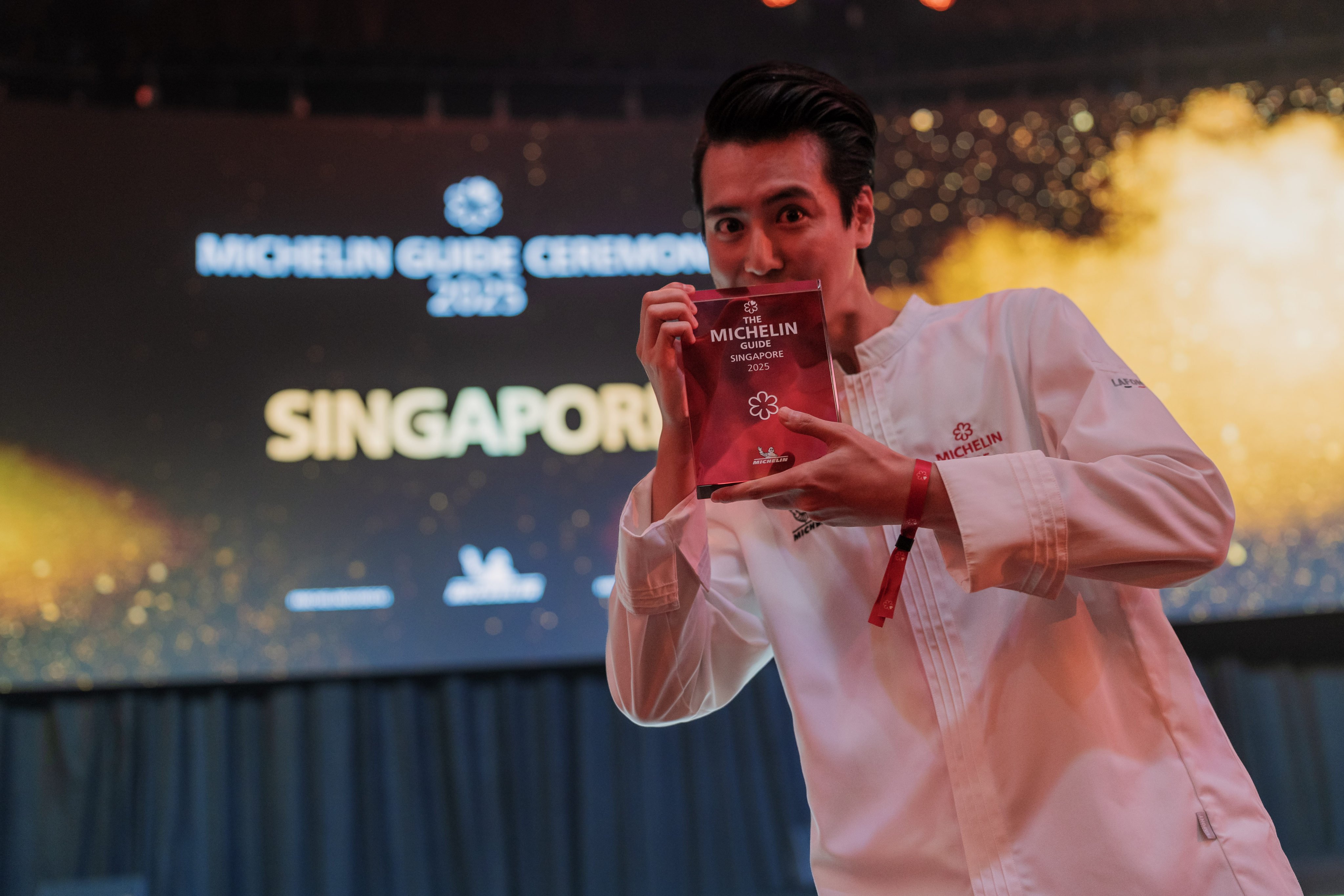 Chef Kazuki Arimoto from Omakase @ Stevens celebrates two wins - his restaurant’s newly awarded one Michelin star, and his Young Chef Award - at the Michelin Guide Ceremony Singapore 2025 at Marina Bay Sands on July 24, 2025. Photo: Michelin Guide Singapore