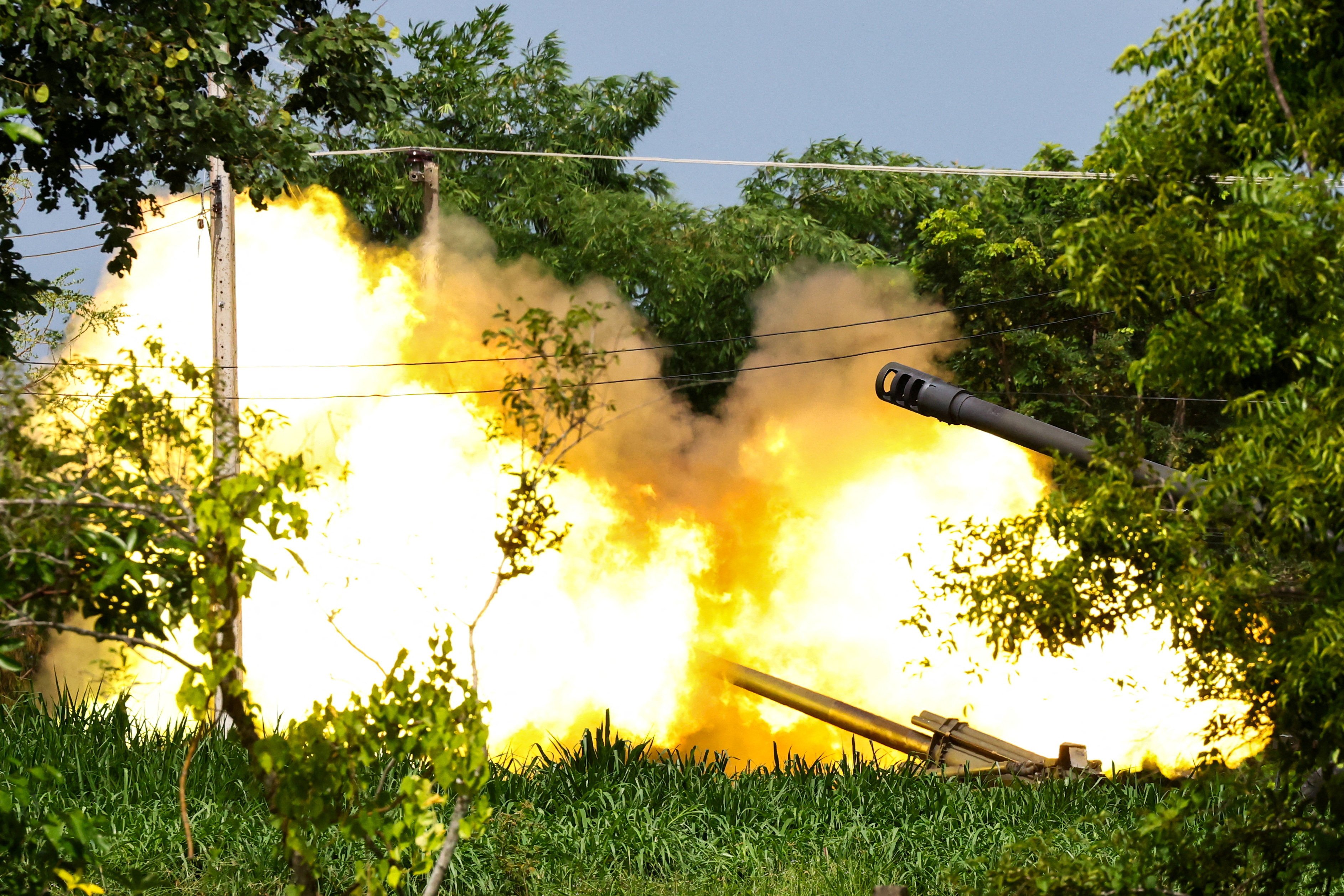 A Thai mobile artillery unit fires towards Cambodia’s positions in Surin province on Friday. Photo: Reuters