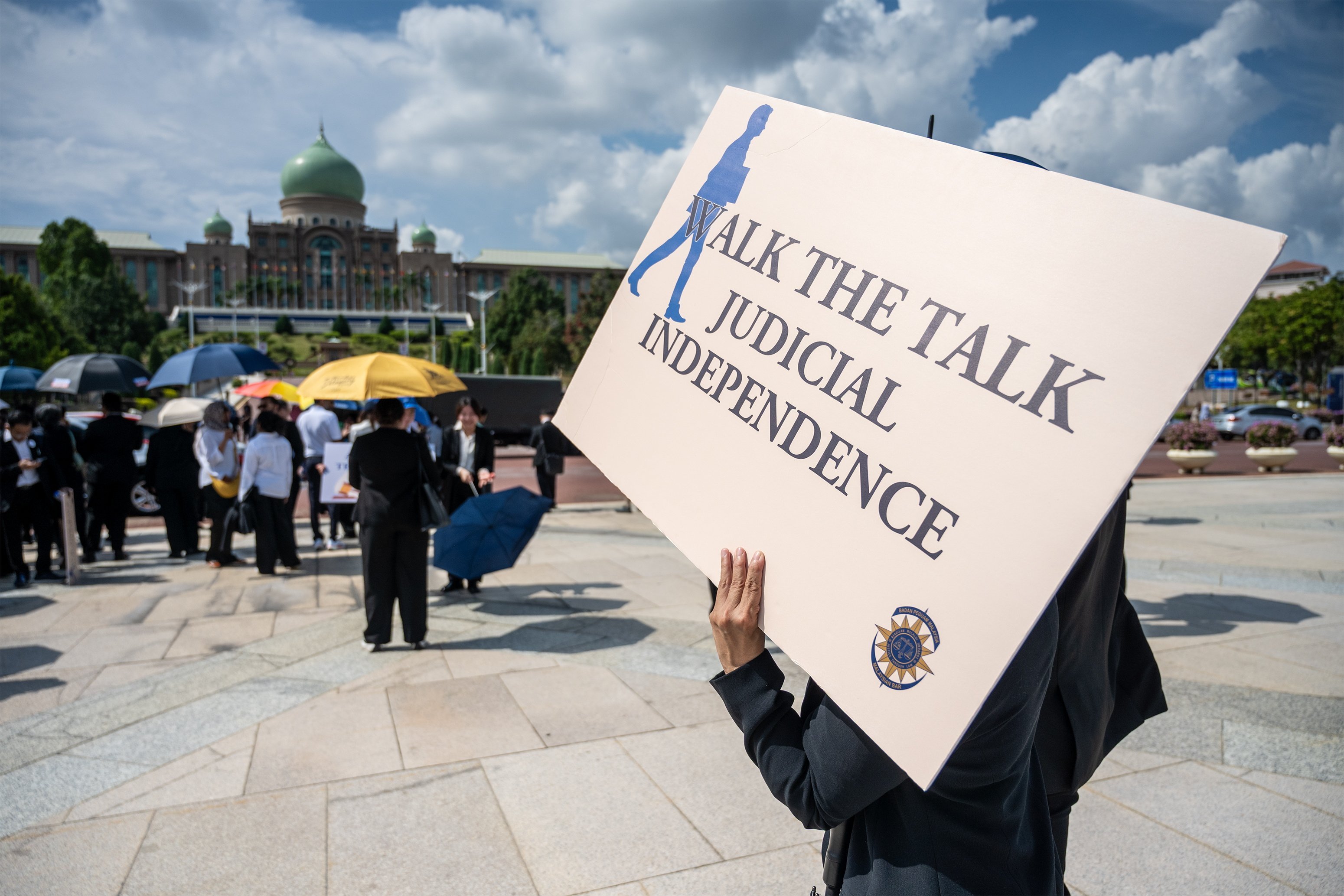 Lawyers and trainee lawyers gather in Putrajaya on July 14 for a “Walk to Safeguard Judicial Independence”. Photo: EPA