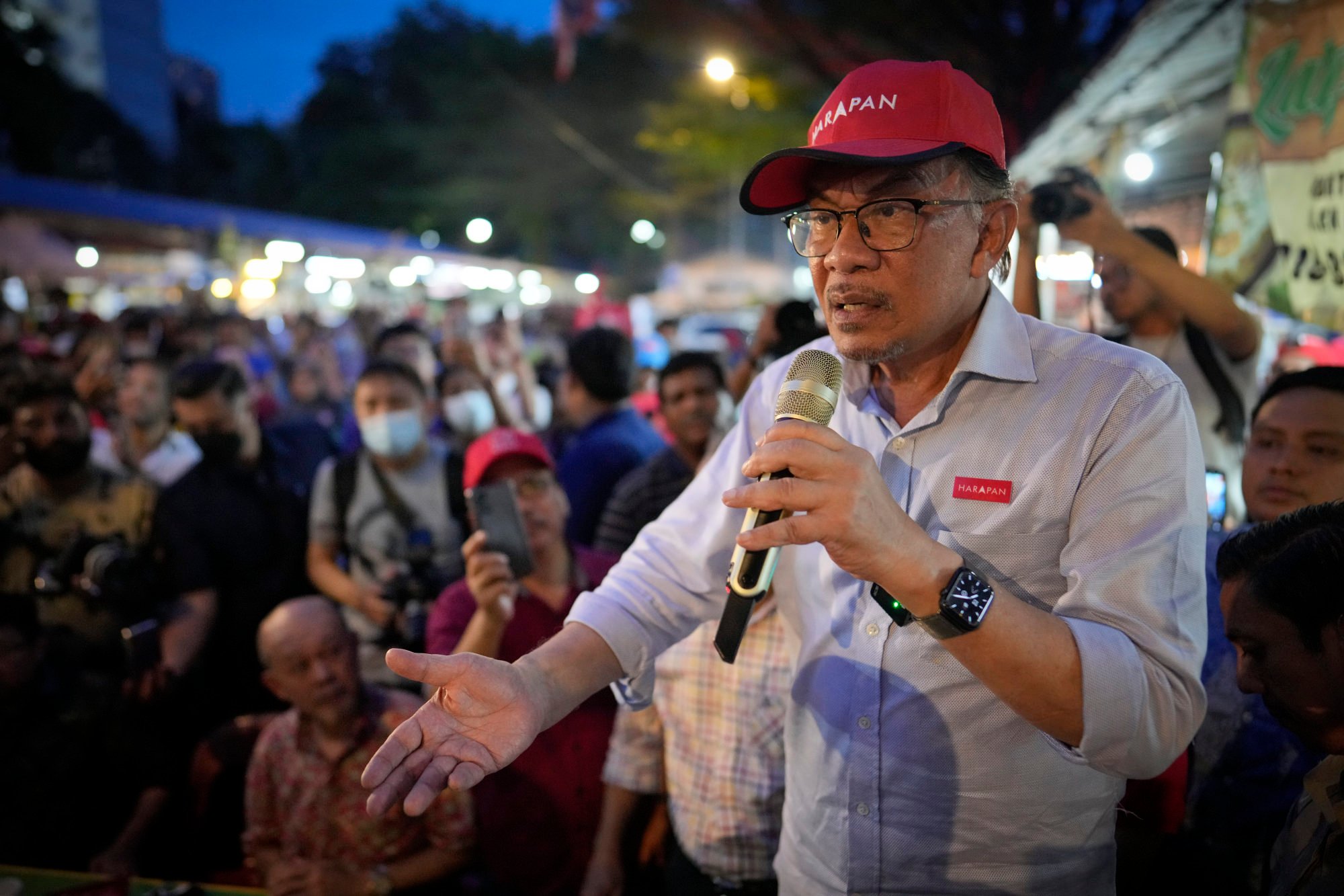 Anwar on the campaign trail in 2022. His Pakatan Harapan coalition won the most seats in that poll, but not the support of the Malay majority. Photo: AP