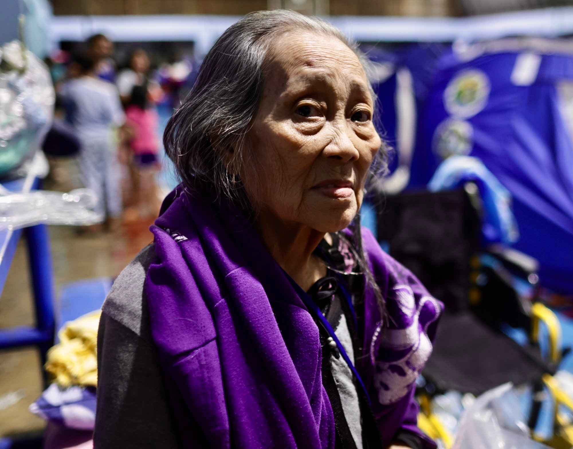 An elderly woman takes shelter inside a temporary evacuation centre in the flood-hit city of Marikina, the Philippines, on Monday. Photo: EPA