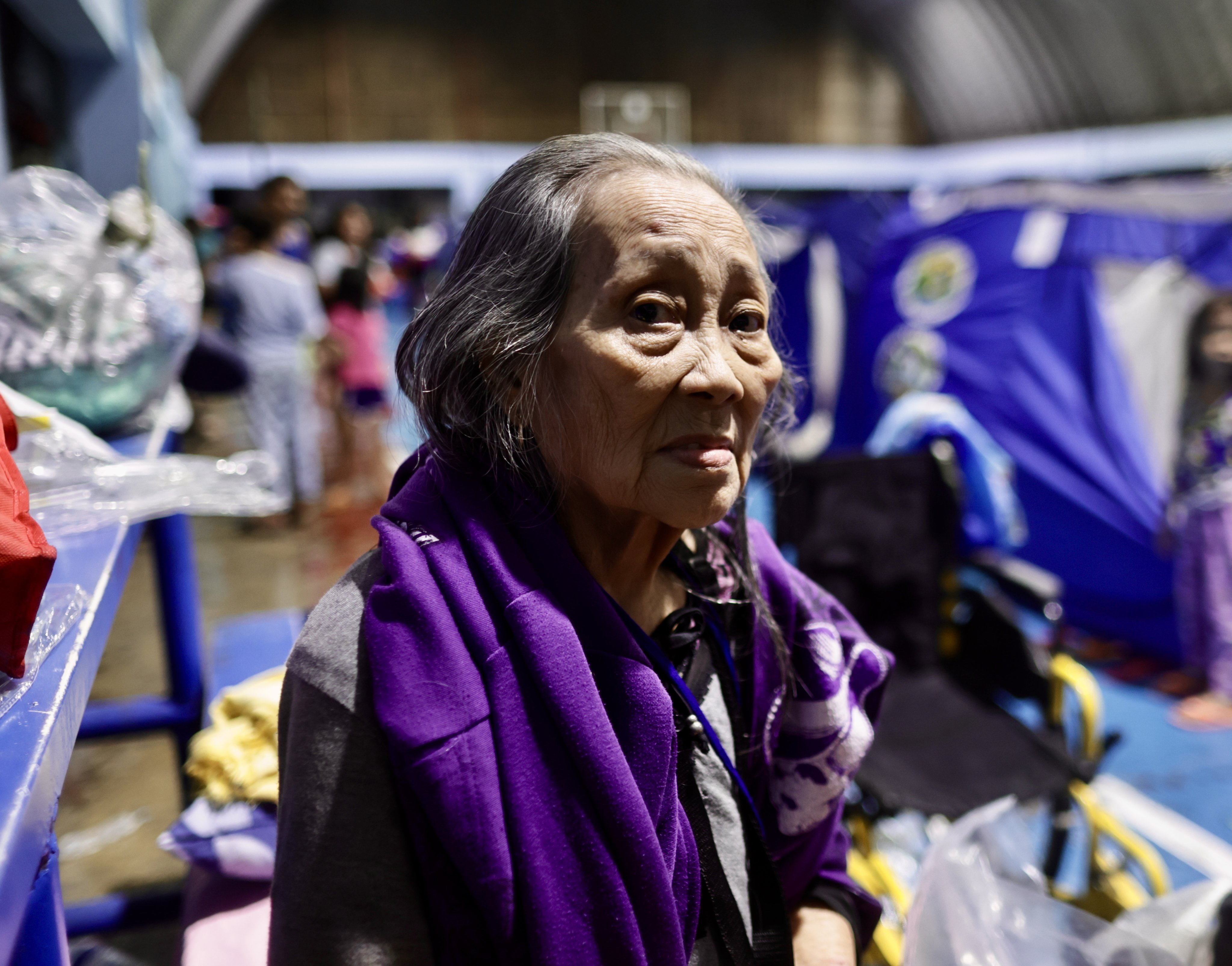 An elderly woman takes shelter inside a temporary evacuation centre in the flood-hit city of Marikina, the Philippines, on Monday. Photo: EPA